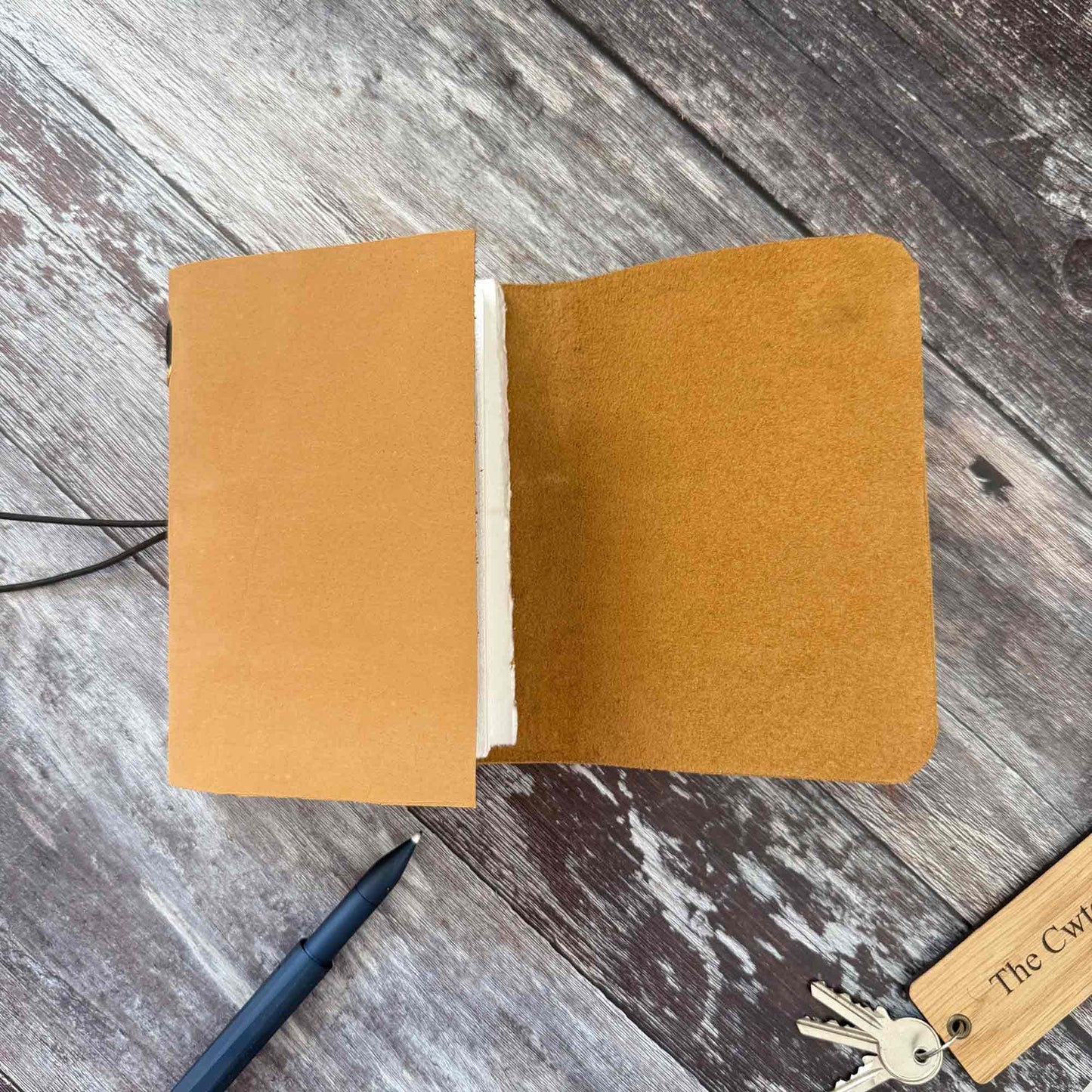 A6 sand leather journal — compact travel‑friendly refillable notebook
