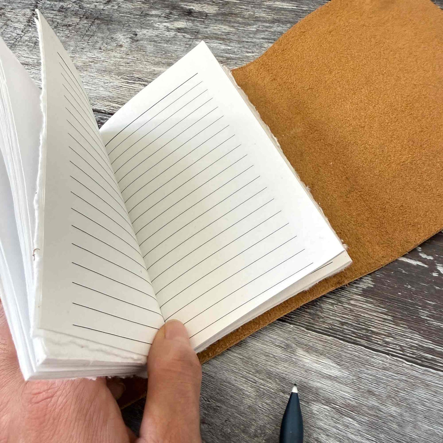 Open sand leather journal with lined handmade cotton paper inserts
