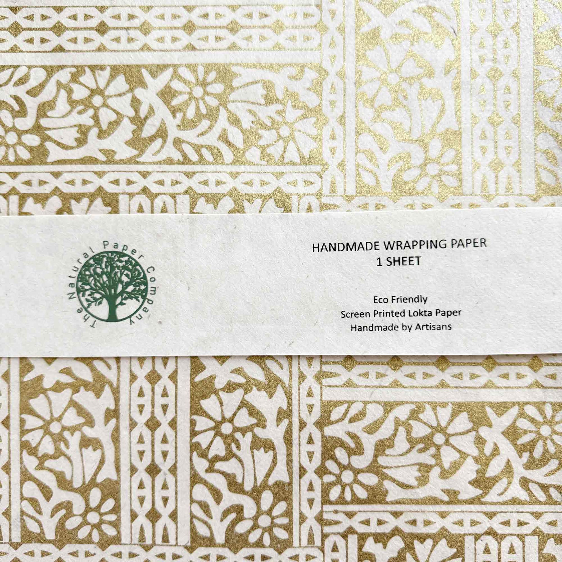 Handmade wrapping paper sheet with gold pattern
