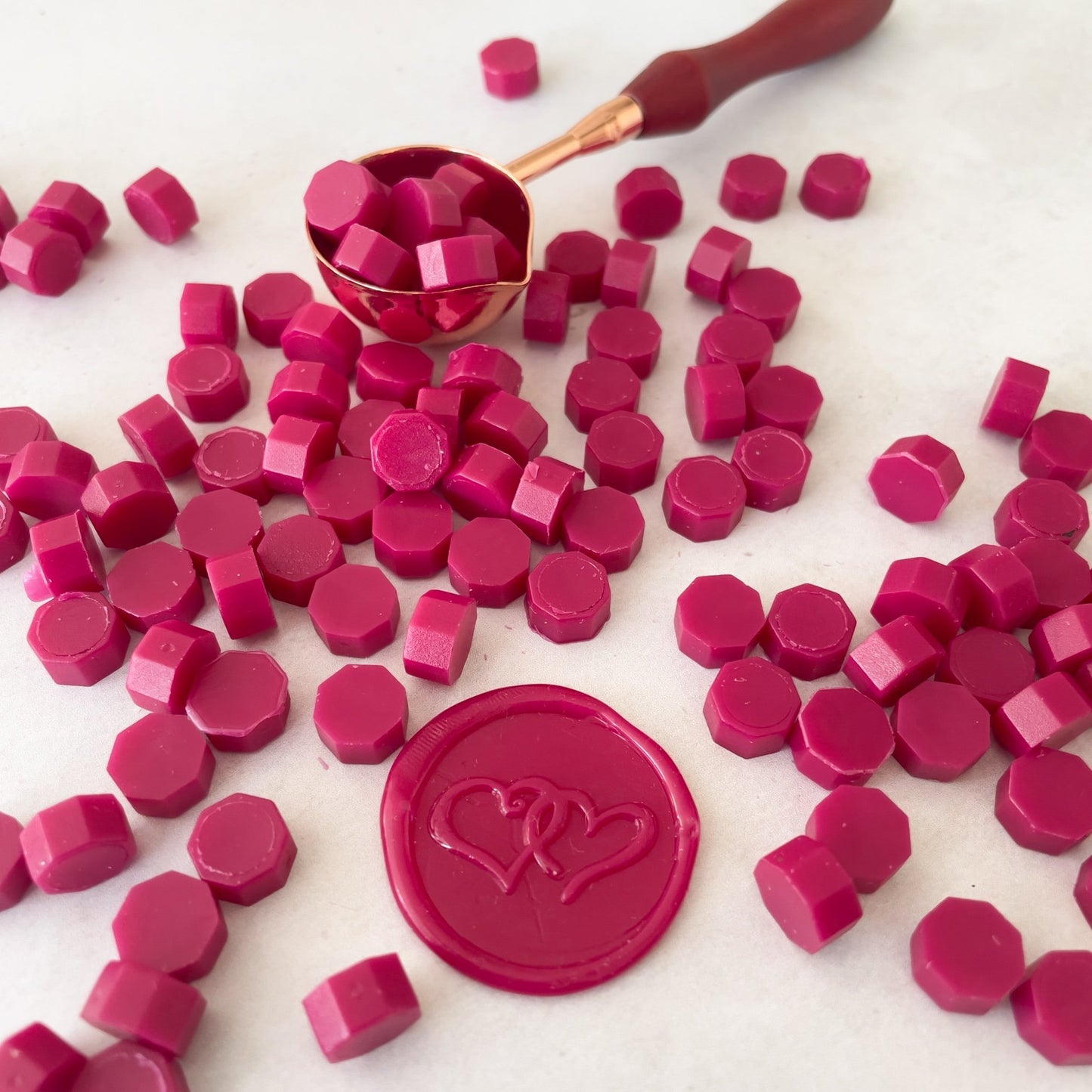 Bright red sealing wax beads to make wax seals.  Eco friendly wax by The Natural Paper Company