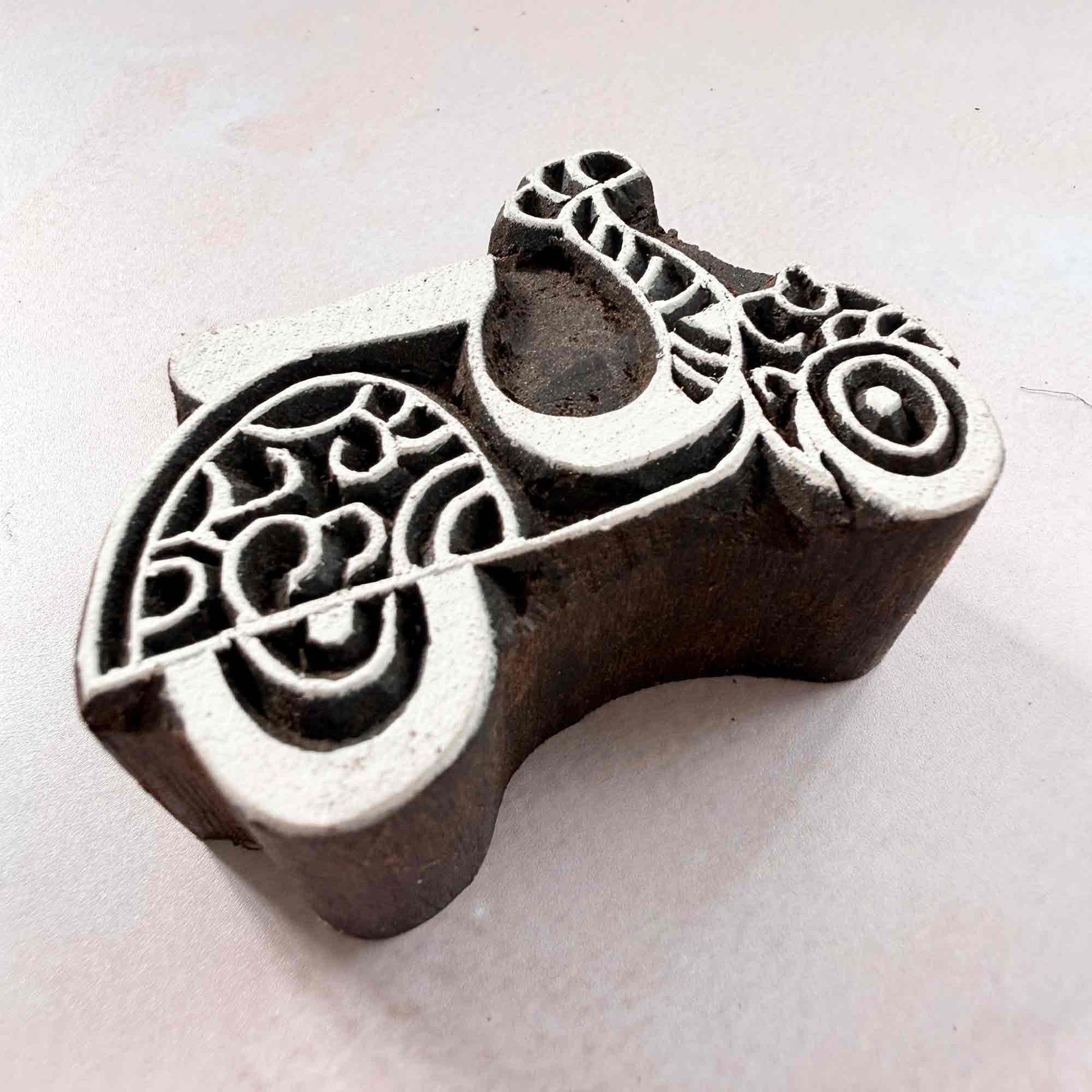 Indian wood block stamp — Scoot decorative scooter viewed from angle, showing carved depth and intricate scrollwork texture, handcrafted wooden stamp, premium traditional printing block hardwood