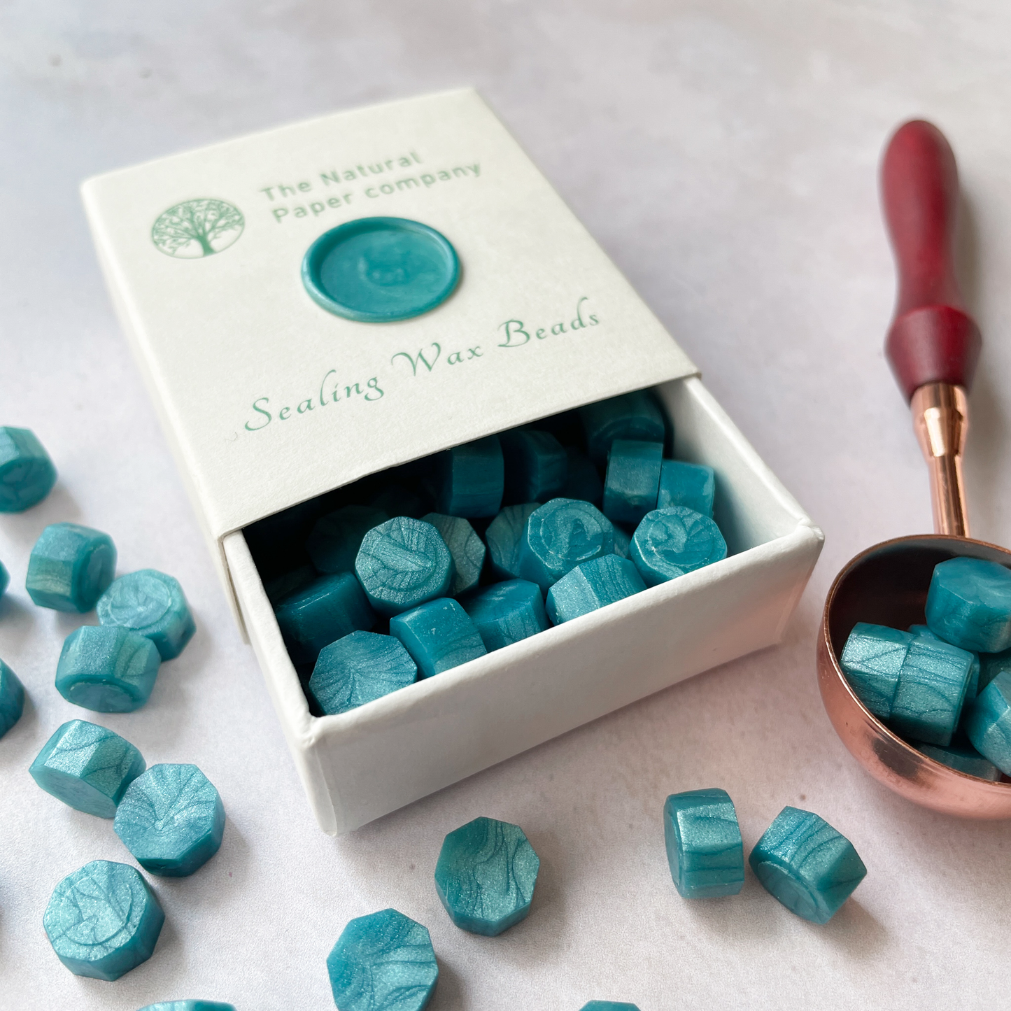 Sea green sealing wax beads to make wax seals.  Eco friendly wax without plastic, paraffin free and biodegradable.  By The Natural paper Company