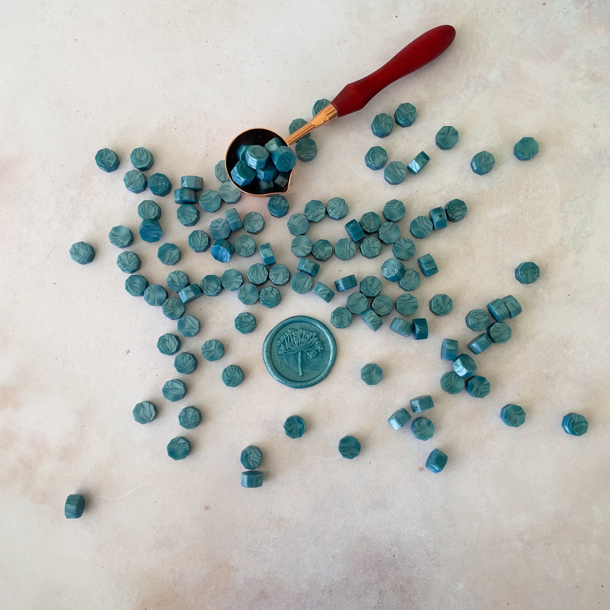 Sealing wax beads in sea green.  Make eco friendly wax seals with out plastic free wax beads by The Natural Paper Company