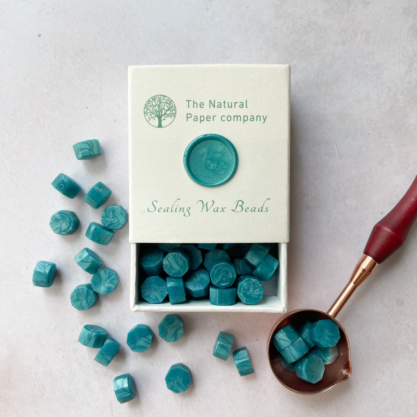 Teal colour sealing wax beads to make wax seals.   Eco friendly wax in sea green.  By The Natural paper Company