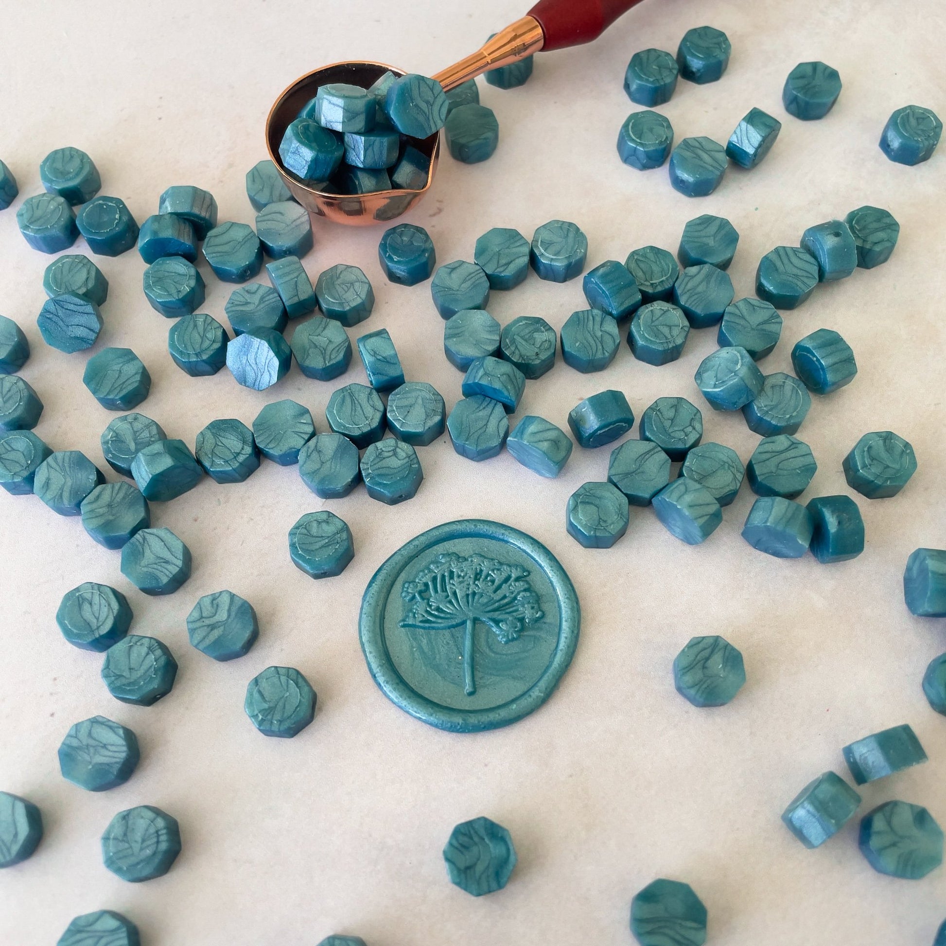 Eco friendly sealing wax beads in sea green.  Small beads of wax to make wax seals.  by The Natural Paper Company