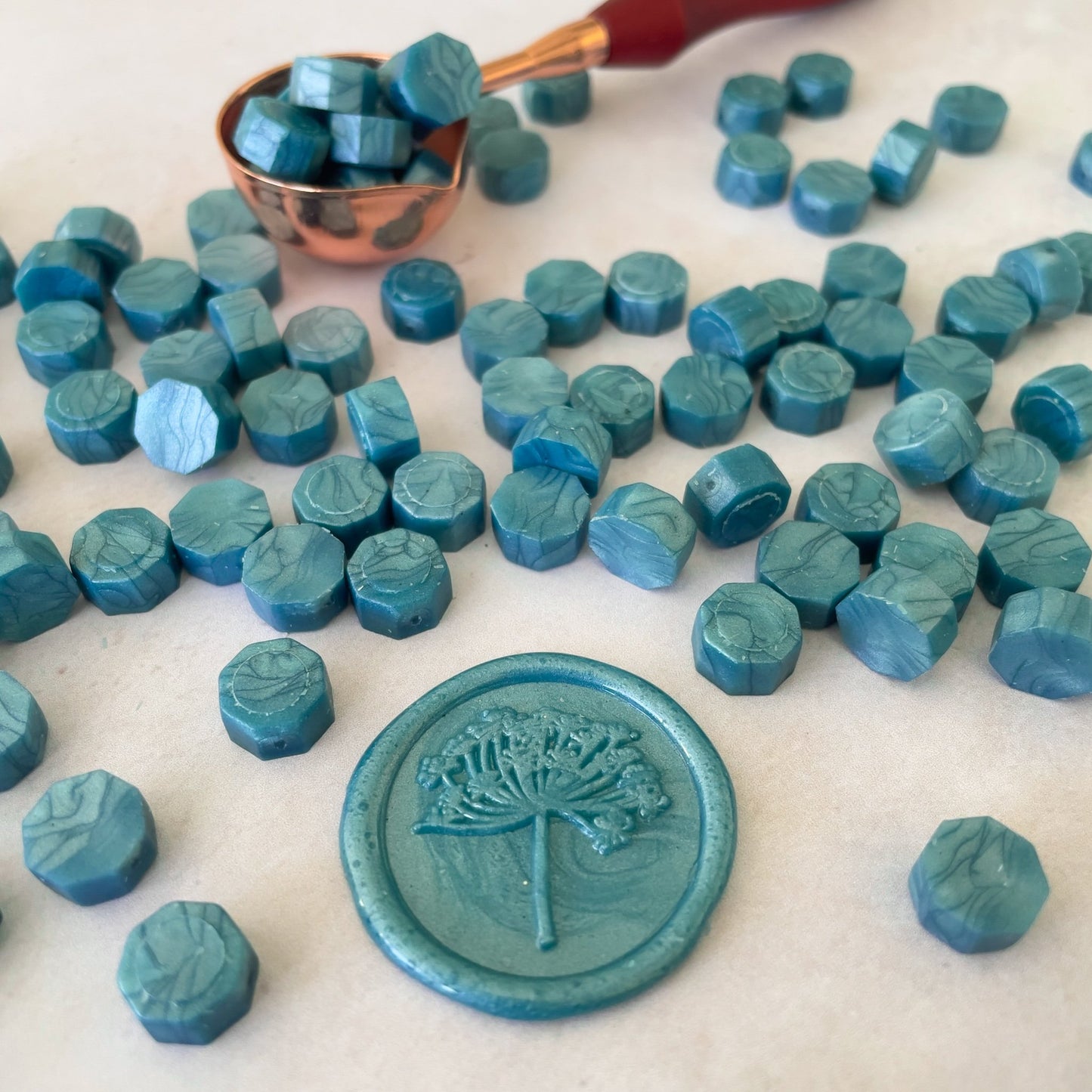 Sea green sealing wax beads by The Natural Paper Company.  Make eco friendly wax seals with our plastic free wax beads in teal. 