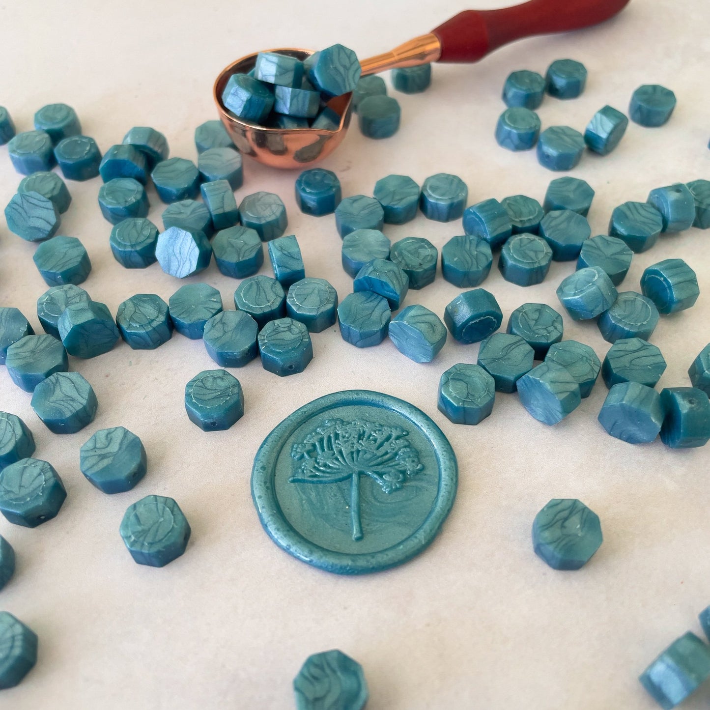 Teal sealing wax beads to make wax seals.  Sea green eco friendly wax beads by The Natural Paper Company