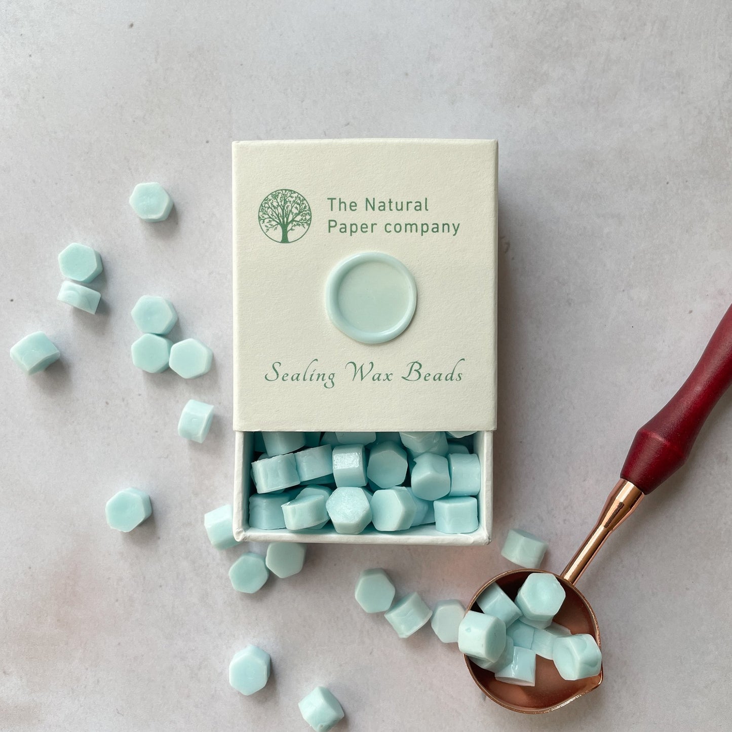 Eco friendly sealing wax beads in aquamarine.  Make wax seals for invitations, envelopes, gift wrapping or packaging.  By The Natural paper Company