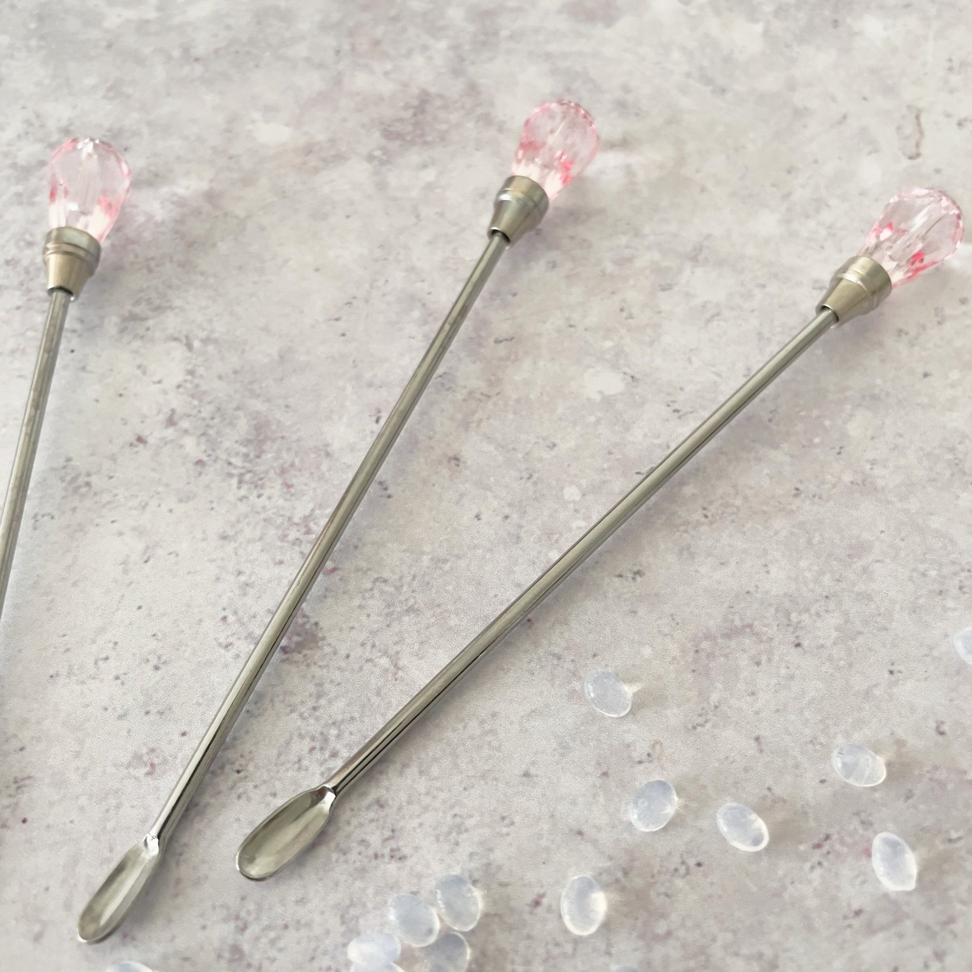 Small stirring spoon for making wax seals.  Stirring bar with a pink crystal head.  By The Natural Paper Company