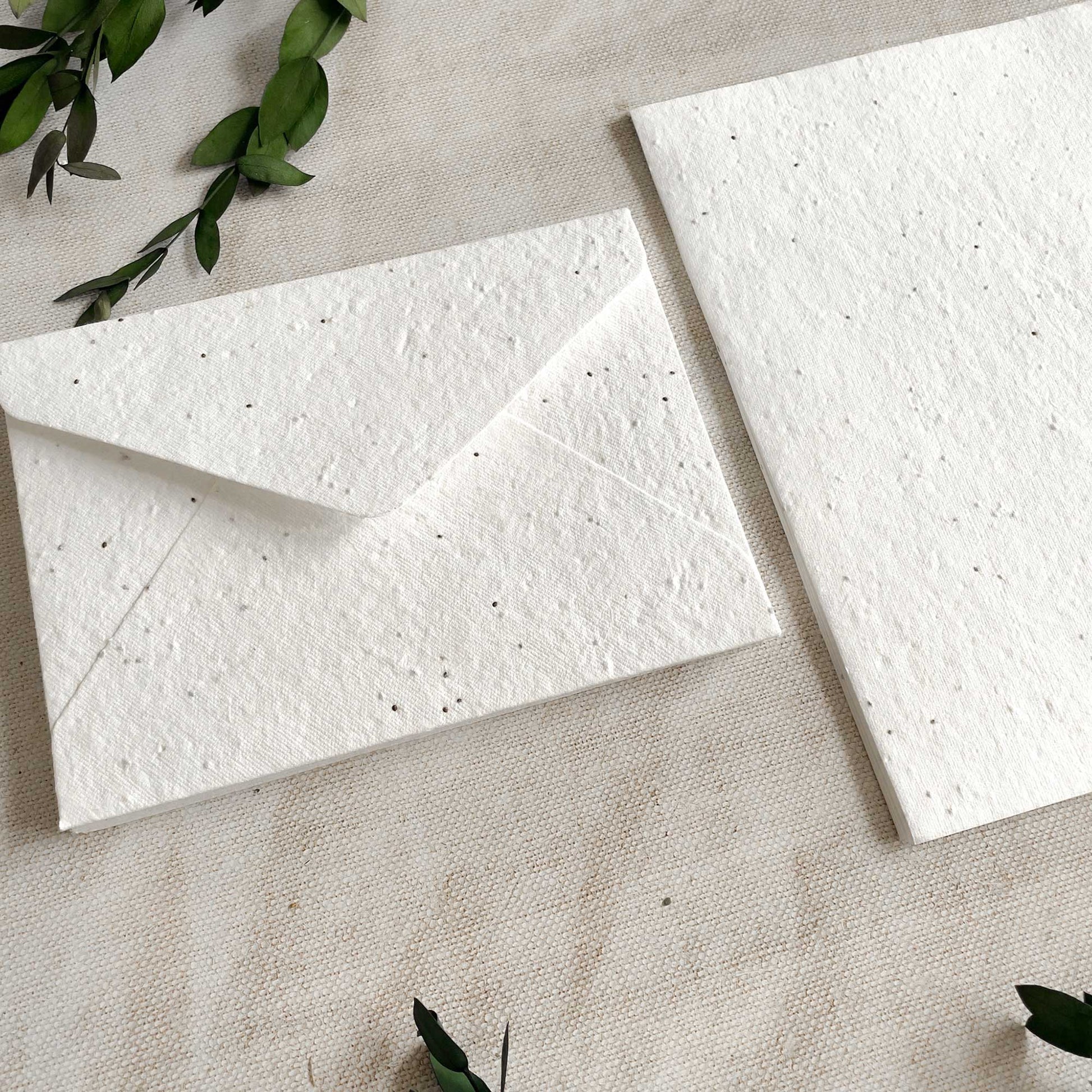 Basil seed plantable paper and envelopes.  Handmade paper and envelopes you can plant.  Seeded paper and envelopes for invitations and more.  By The Natural Paper Company