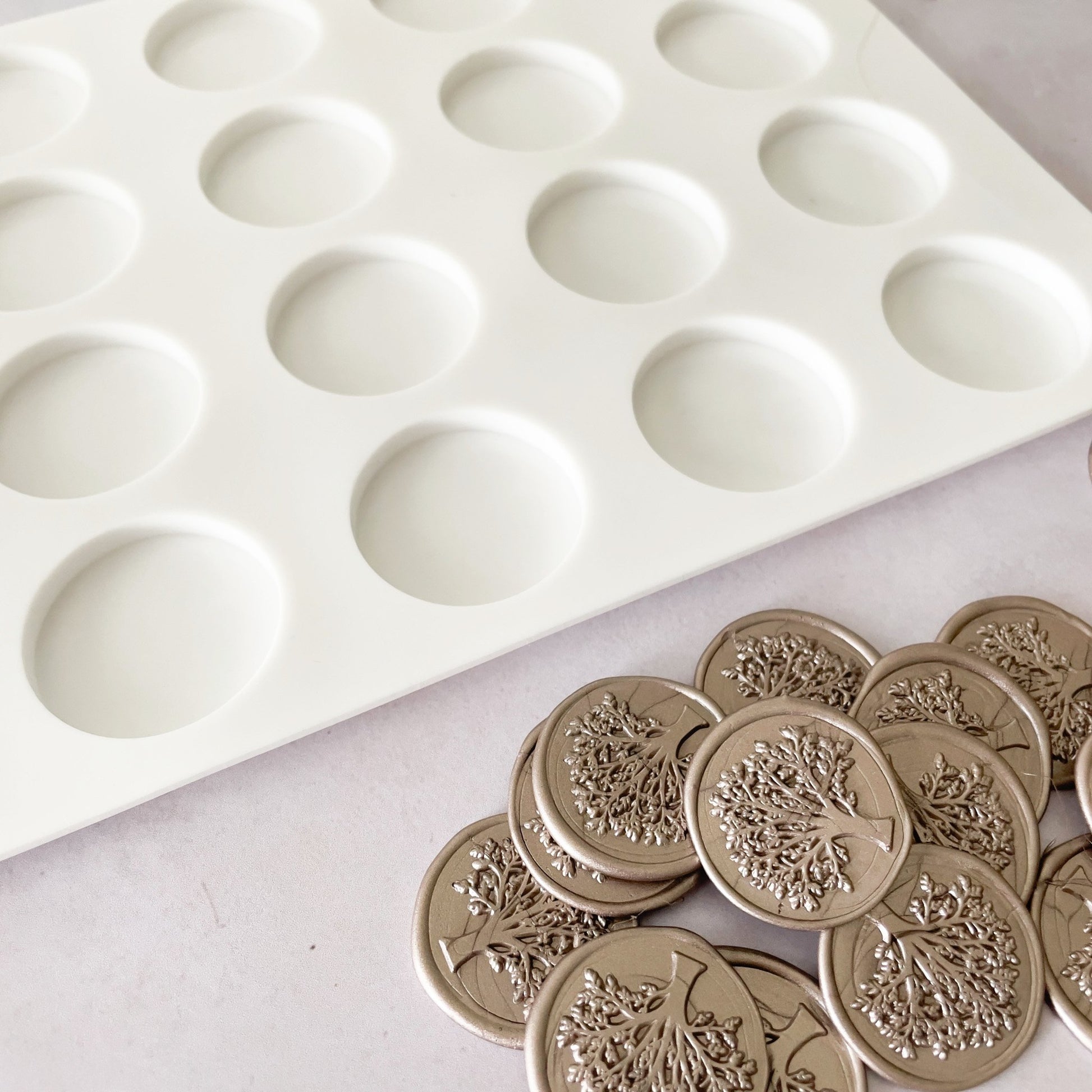 Silicon wax seal mat with round holes.  Non stick mat for making wax seals in bulk.  By The Natural Paper Company