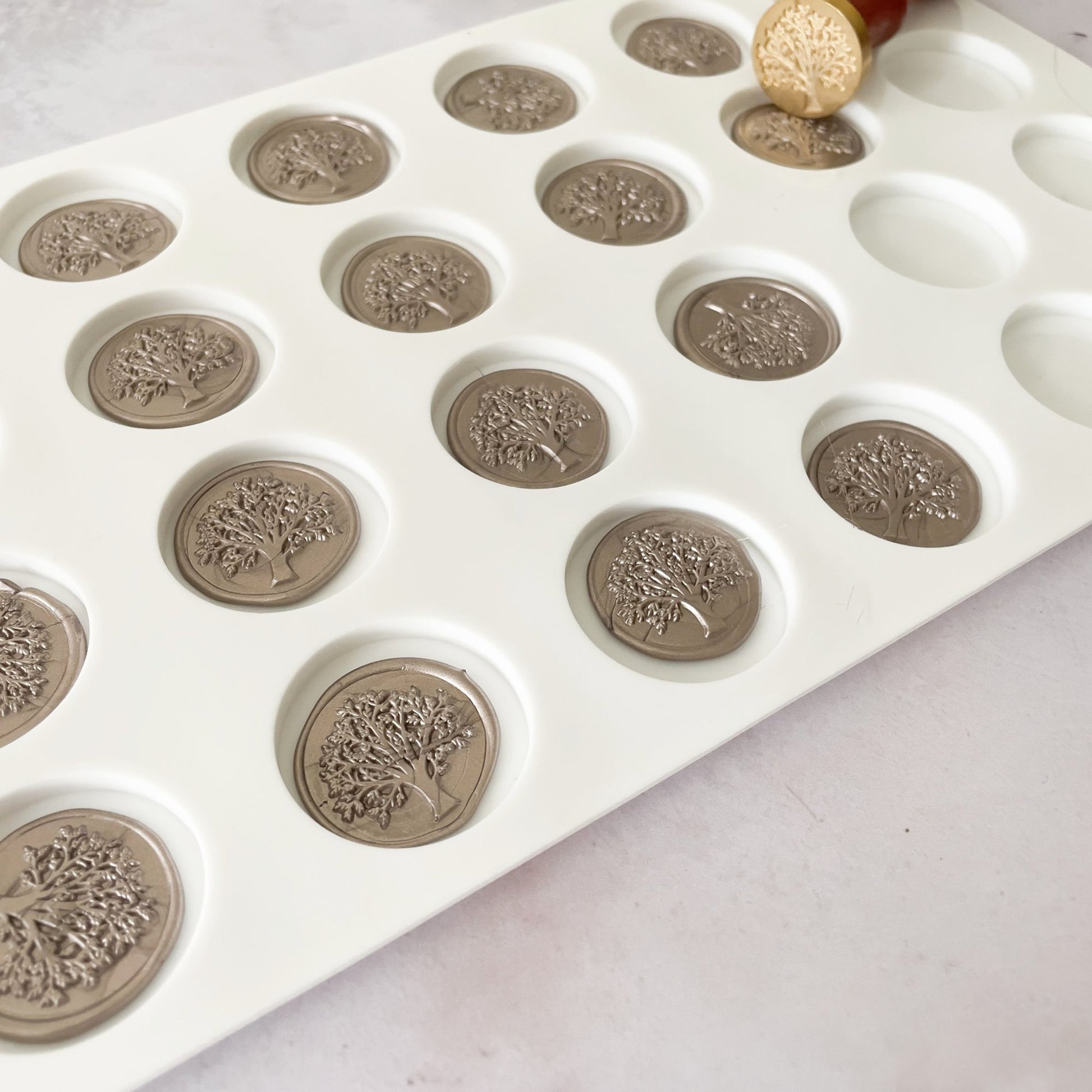 Wax seal mat with cavities.  Tool for making wax seals in bulk.  Non stick ceramic tray for sealing wax by The Natural Paper Company