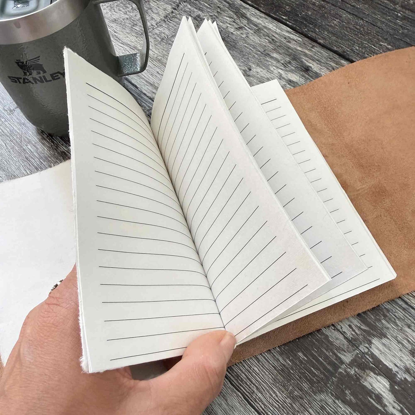 Open silver leather journal with lined handmade cotton paper inserts
