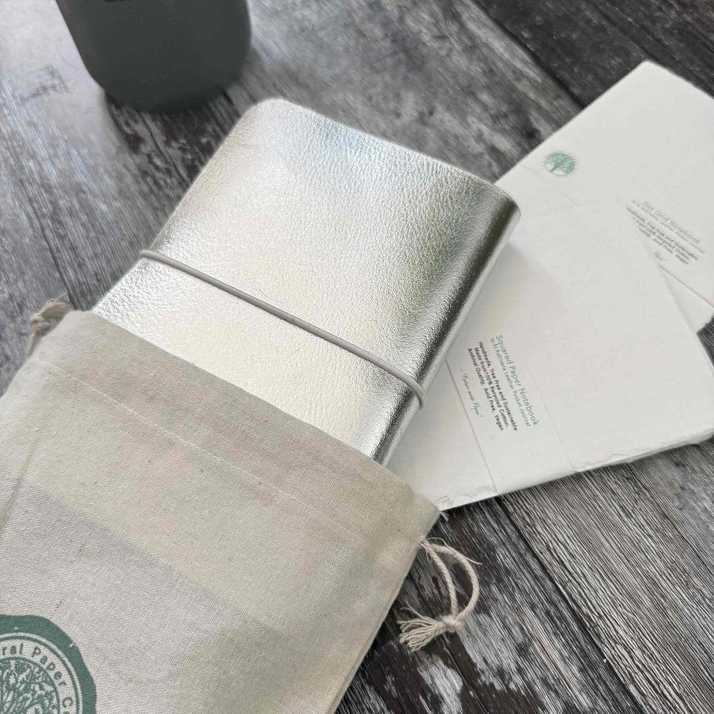 Silver leather journal presented in gift bag — ready for gifting