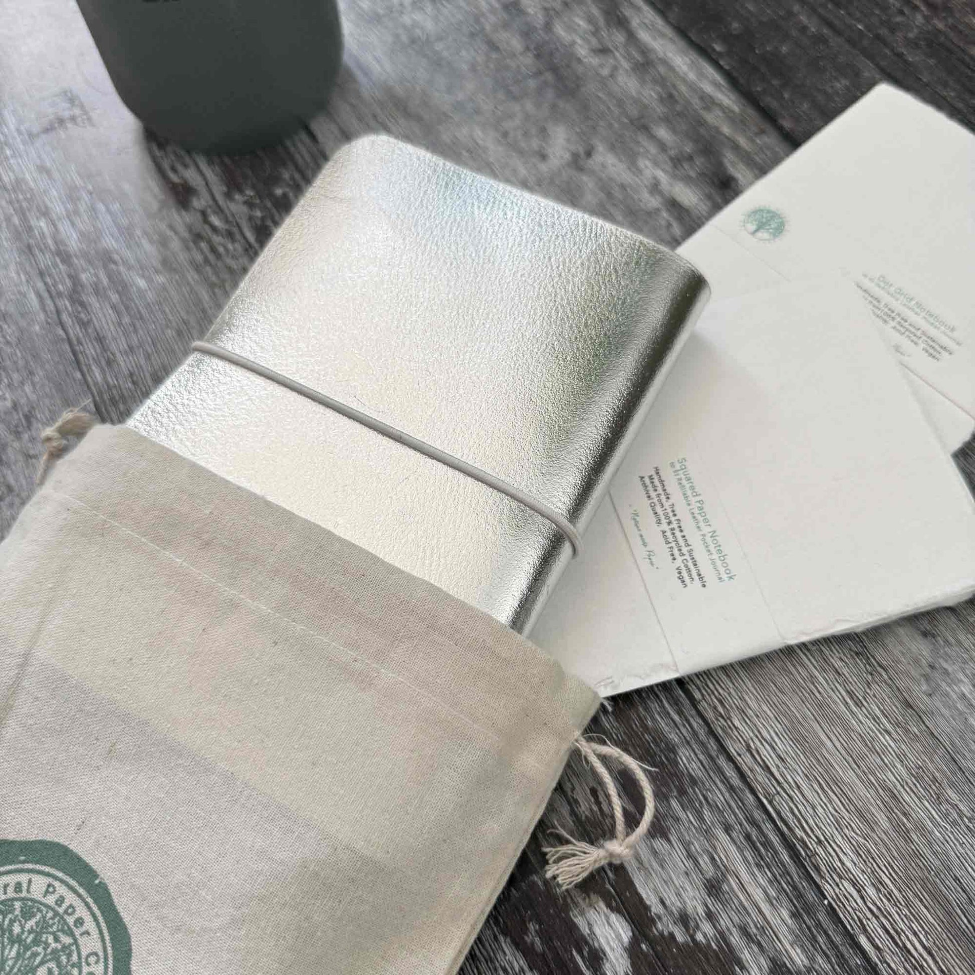 Silver leather journal presented in gift bag — ready for gifting