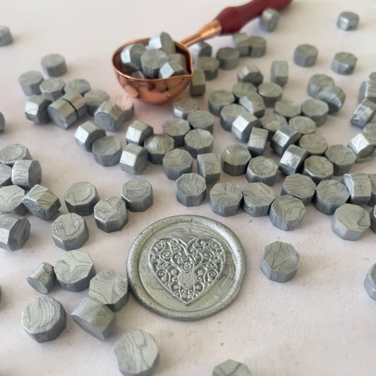 Sealing wax beads in metallic silver.  Make eco friendly wax seals in silver.  by The Natural Paper Company