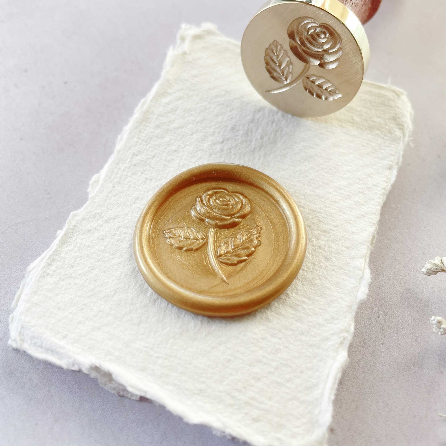 Sleeping beauty sealing wax stamp by The Natural Paper Company. Wax seal with a rose design.