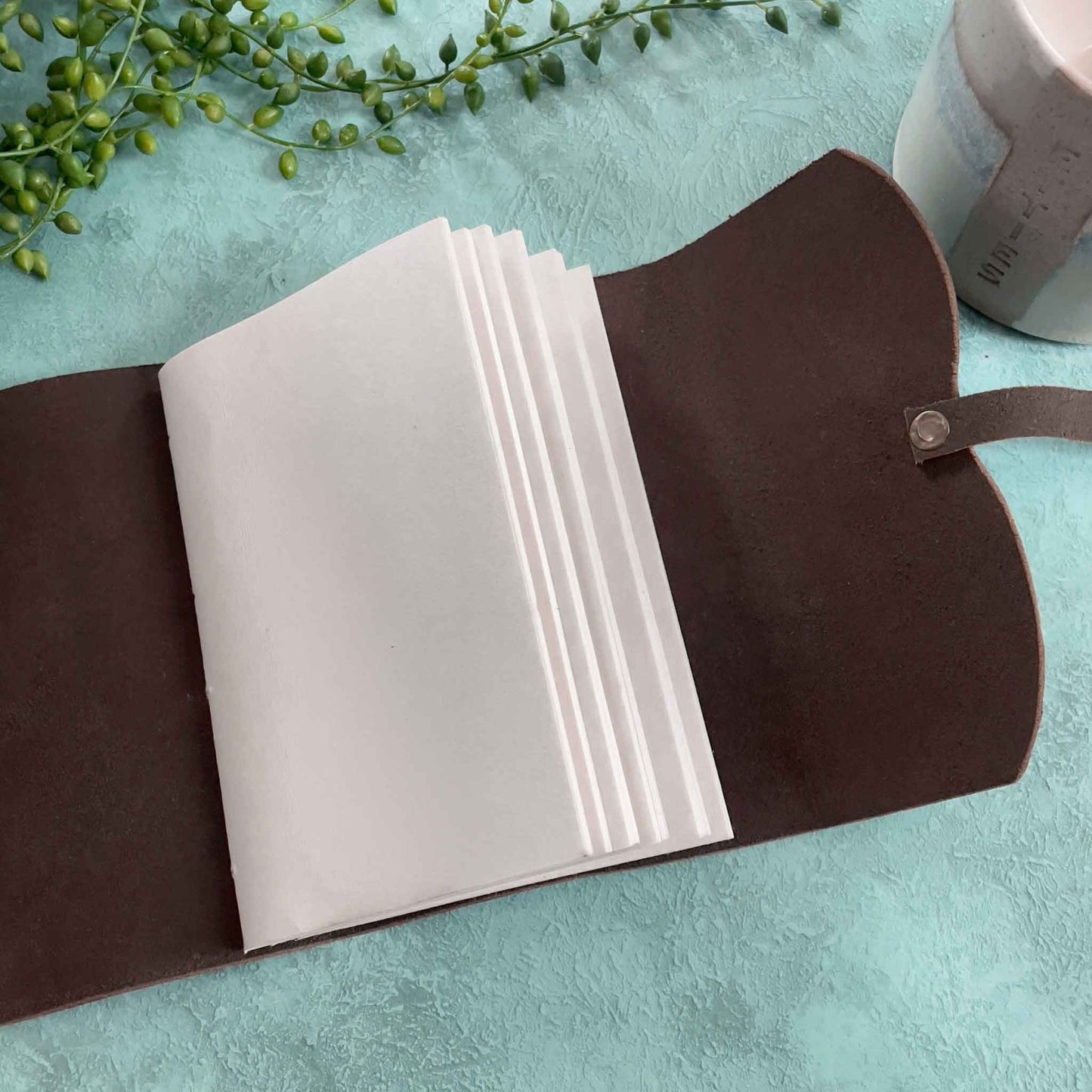 handmade leather notebook with recycled cotton rag paper pages.  Small Dark brown leather notebook