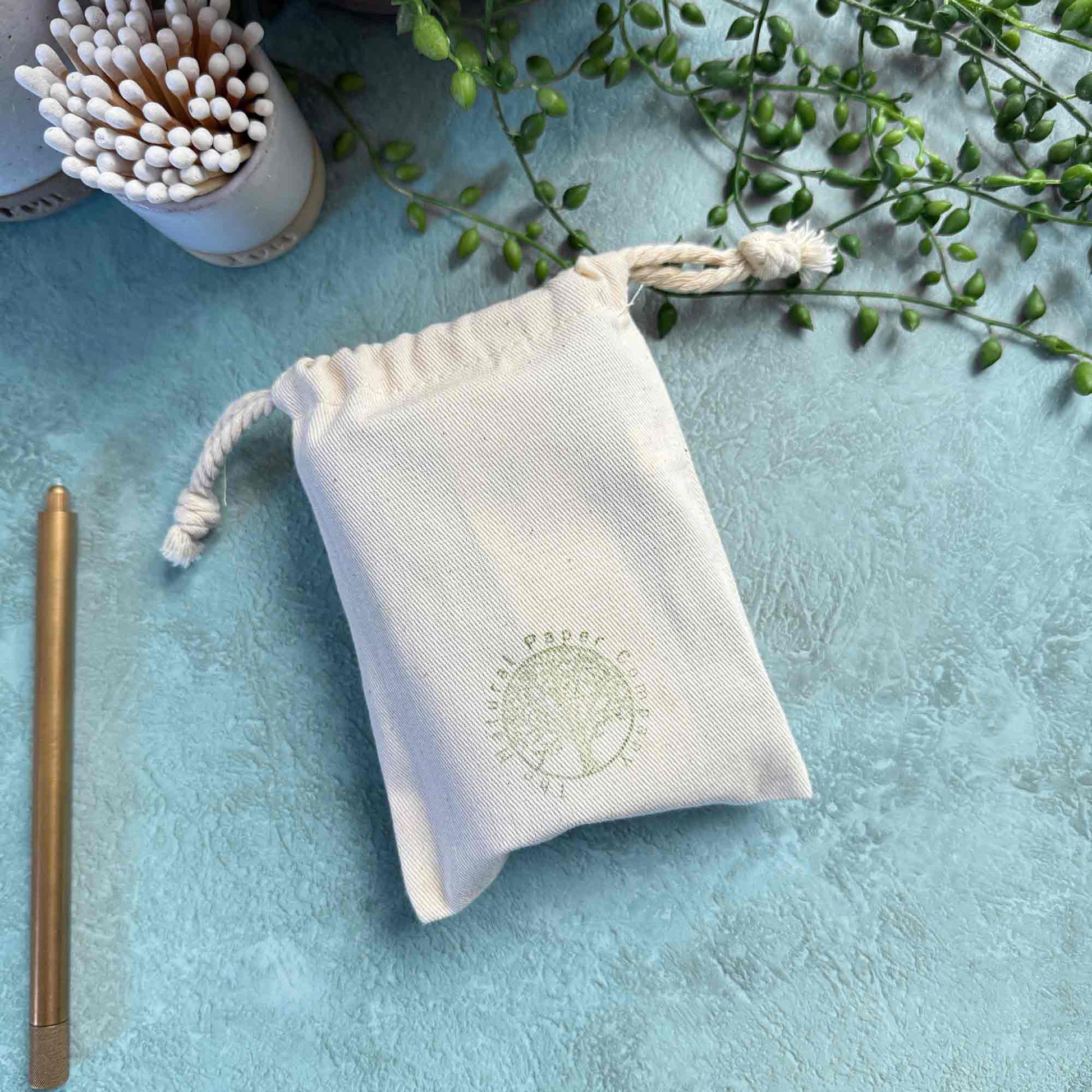 miniature handmade leather notebook in a branded gift bag