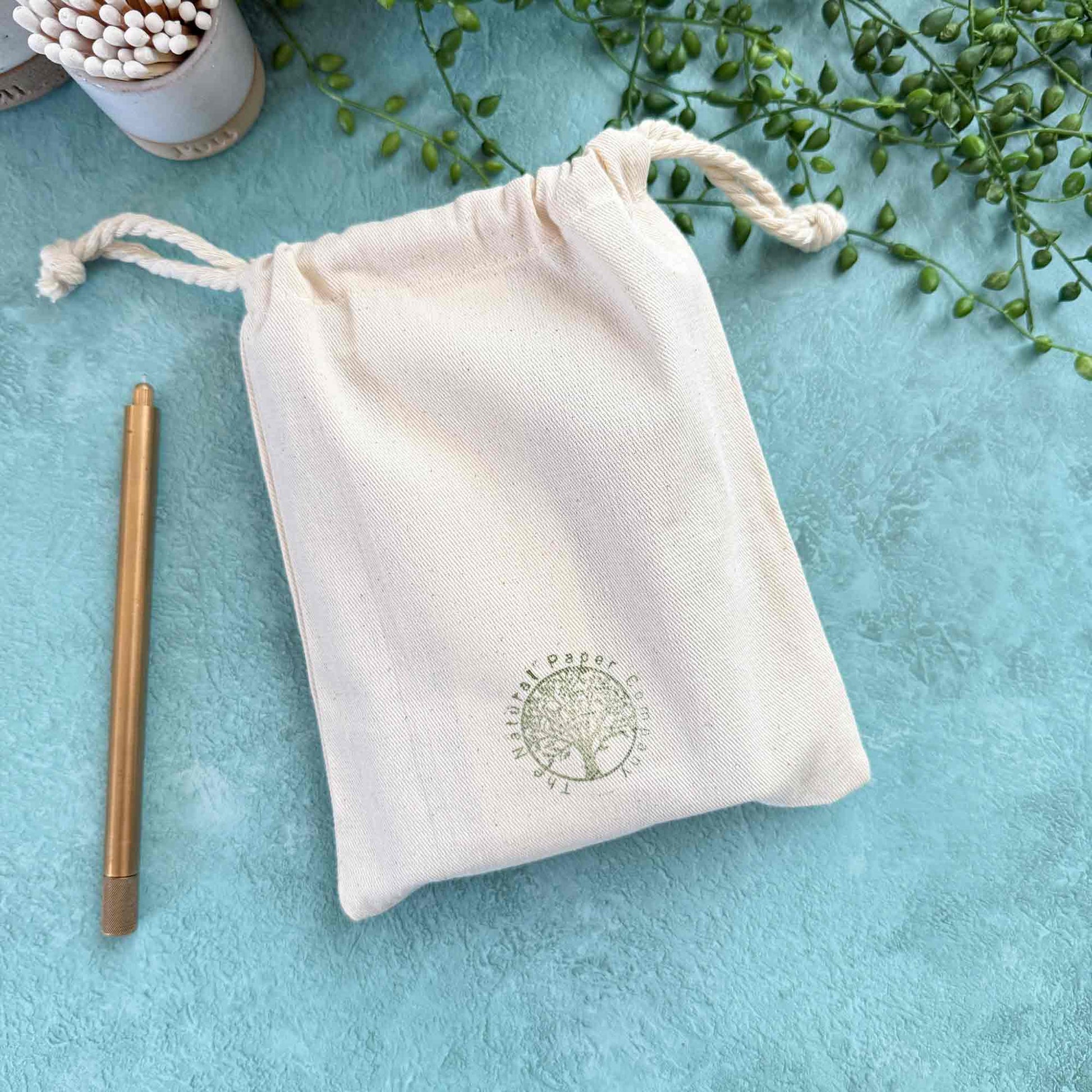 handmade leather notebook in a branded gift bag from The Natural Paper Company