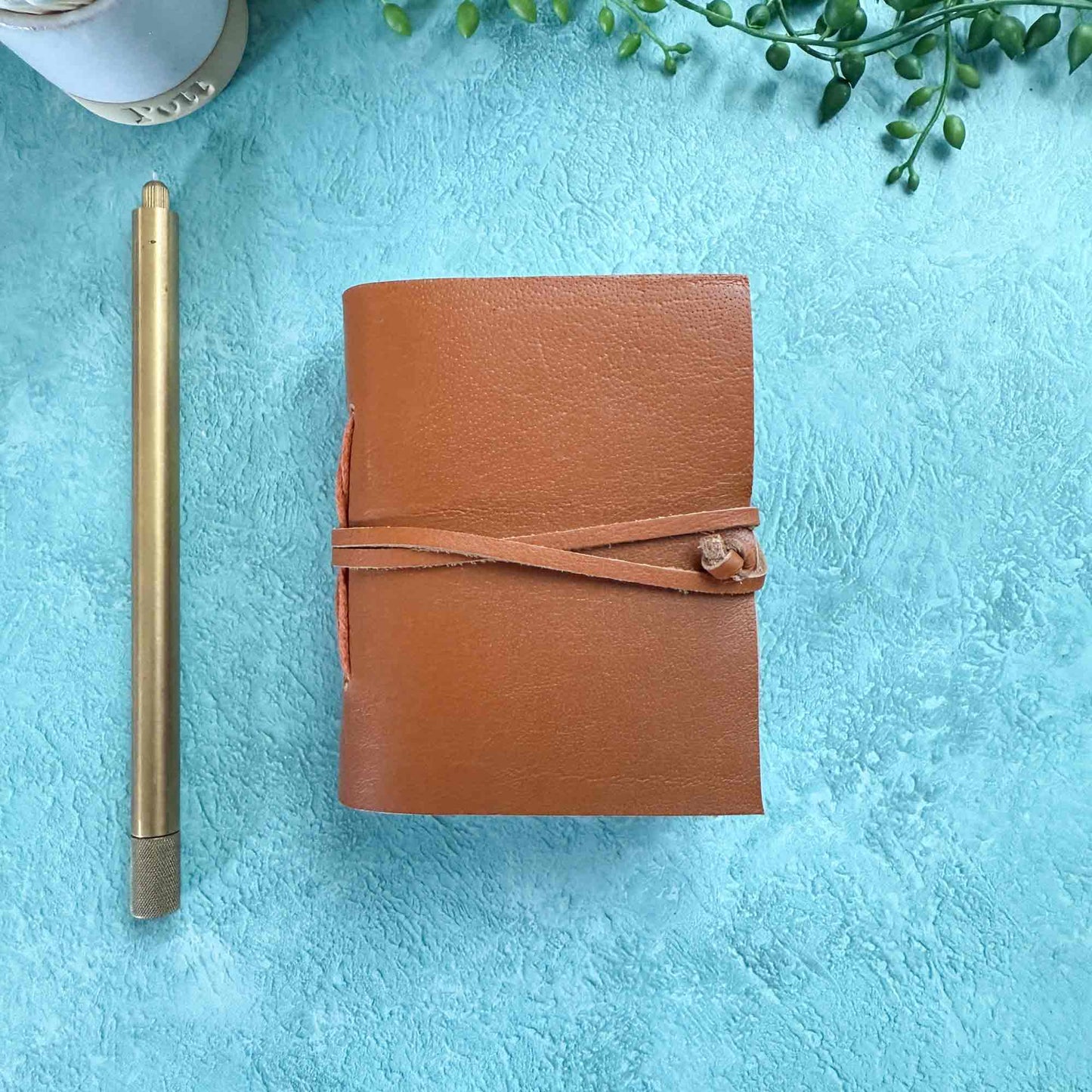 miniature leather pocket notebook in tan