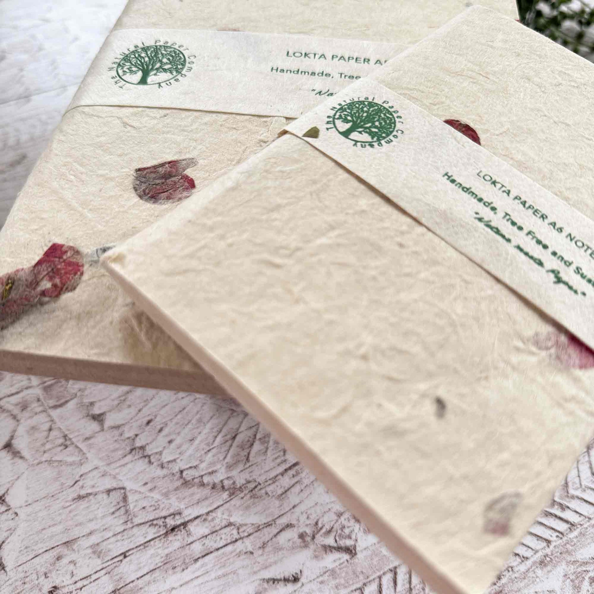 Detailed shot of A5 and A6 Bougainvillea Lokta notebooks, highlighting paper thickness, texture, and brand labelling