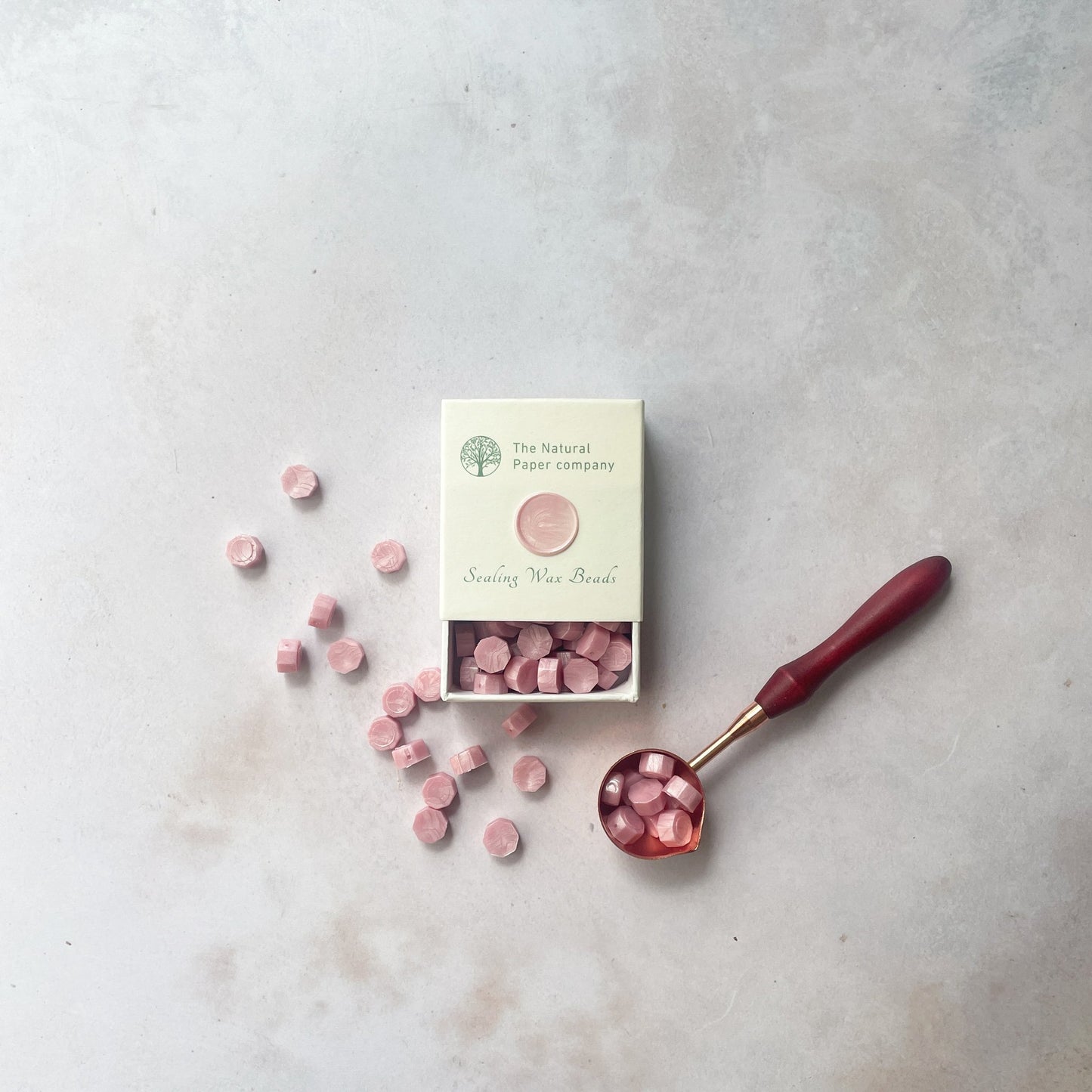 Light pink sealing wax beads to make wax seals.  Small hexagon beads of wax in pearlised pink.  Plastic free, paraffin free and biodegradable.  