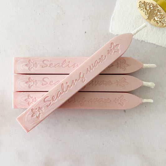 pearlised blush pink wax for making stamps and seals.  Sealing wax sticks with wick
