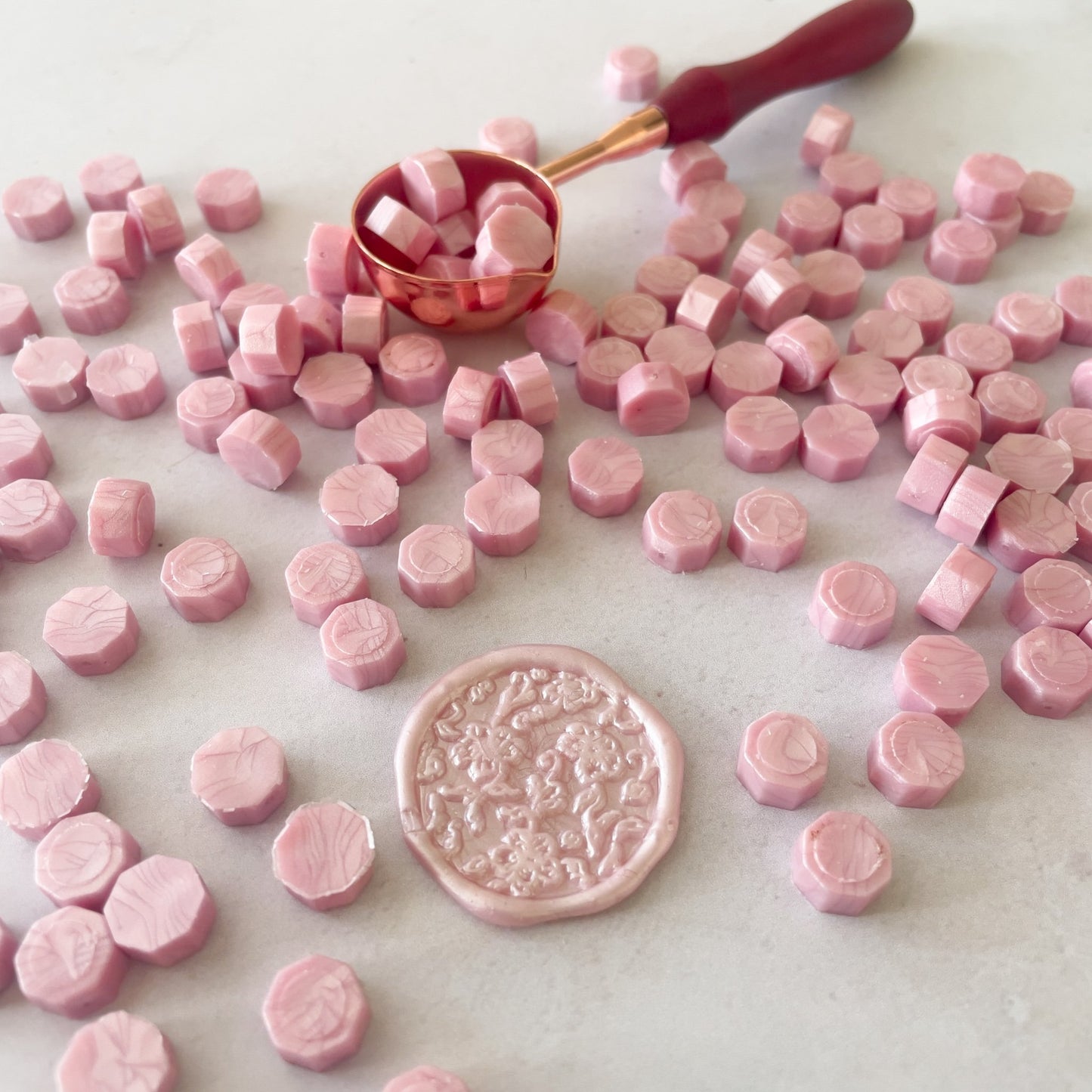 Small beads of wax for making wax seals.  Light pink eco friendly sealing wax beads.  by The Natural Paper Company