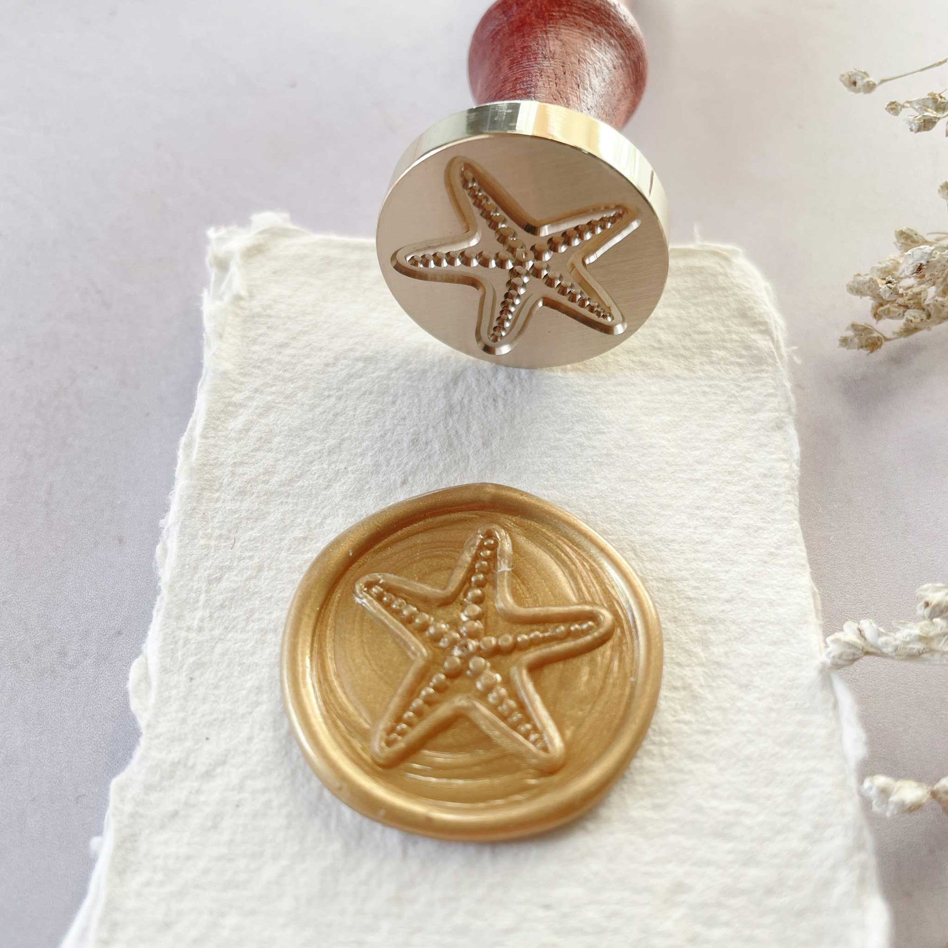 Starfish pattern wax seal By The Natural Paper Company.  Make beach theme wax seals with your choice of eco friendly sealing wax.  By The Natural Paper Company