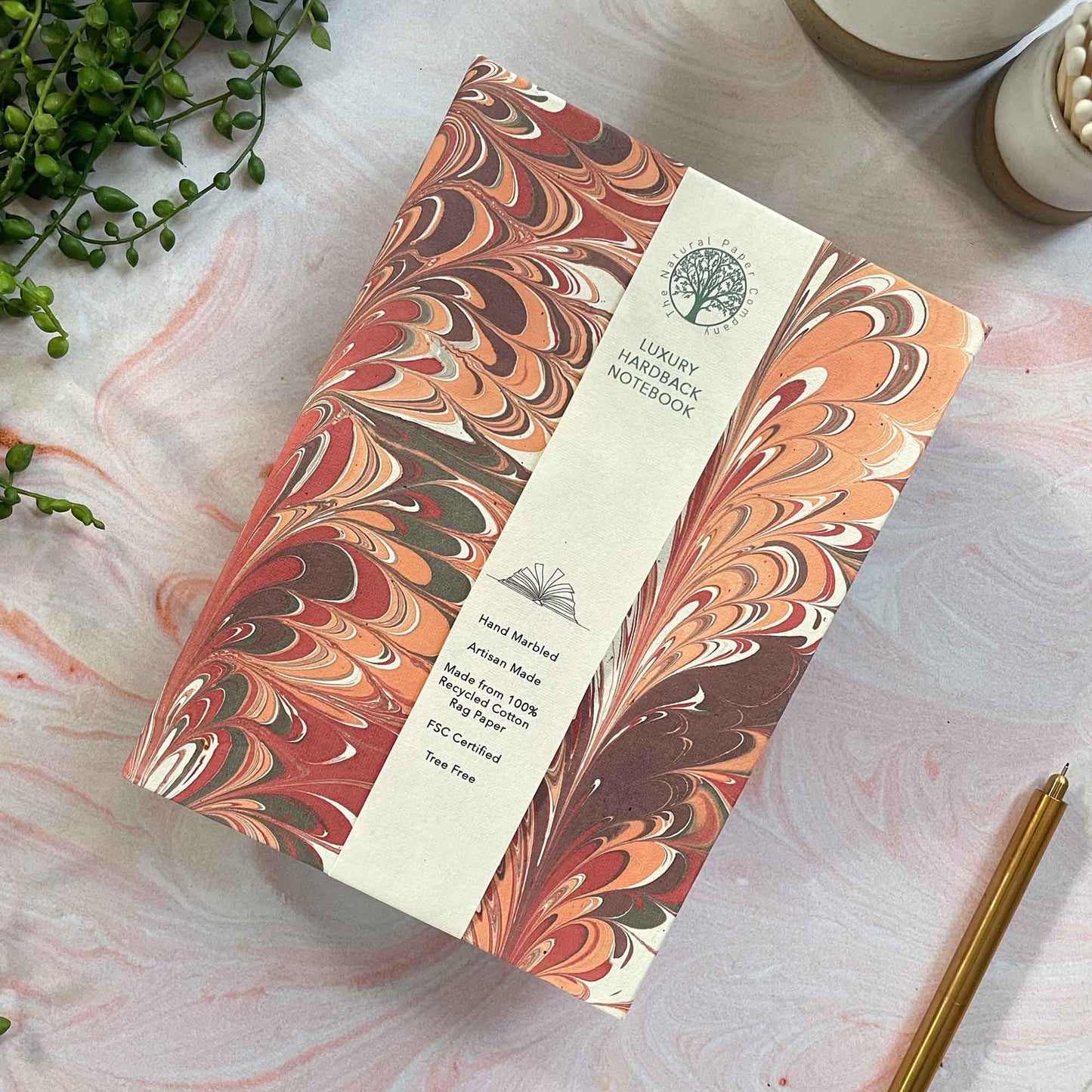 Hardback notebook made from recycled paper.  Hand marbled journal by The Natural Paper Company