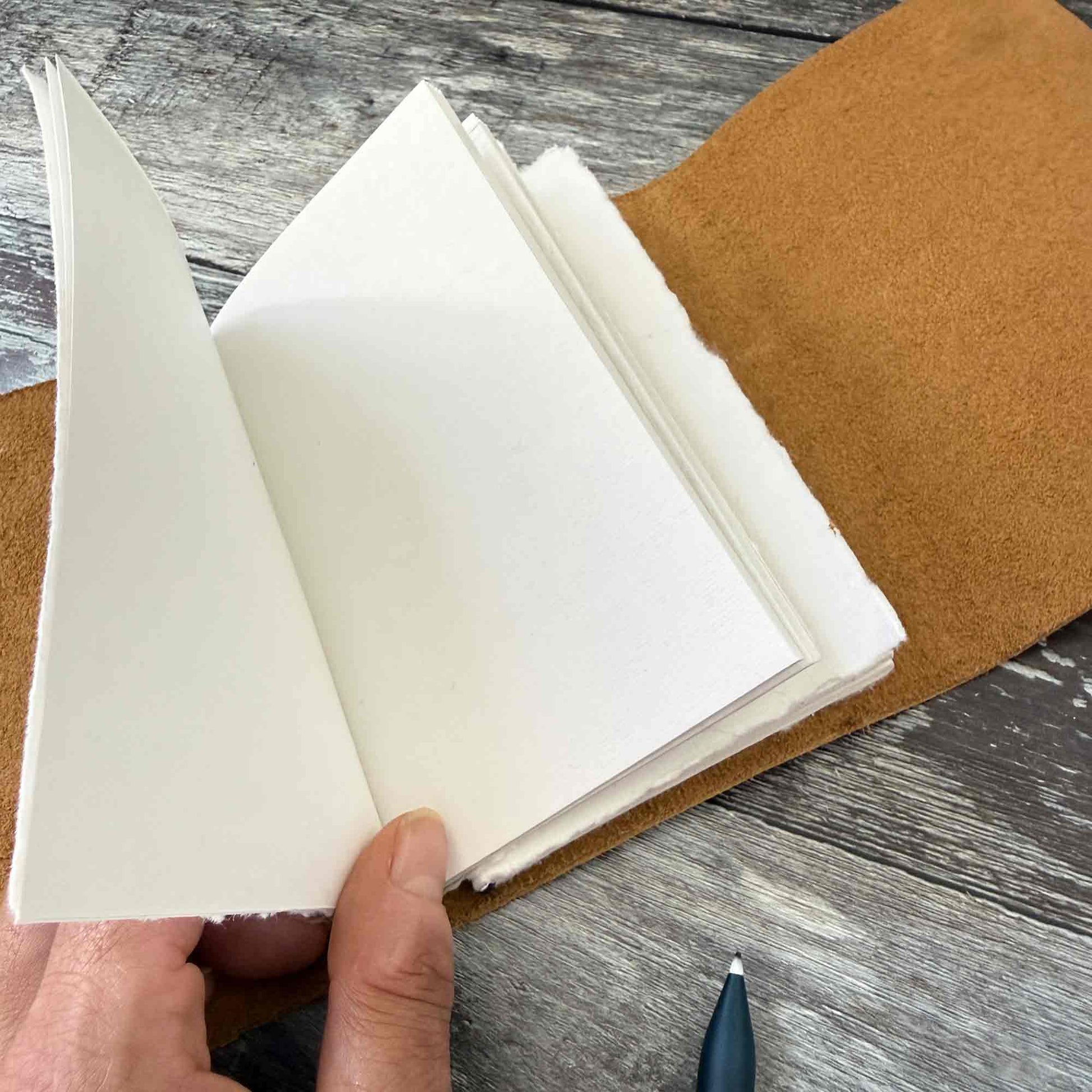 Open sand leather journal with blank  handmade cotton paper inserts
