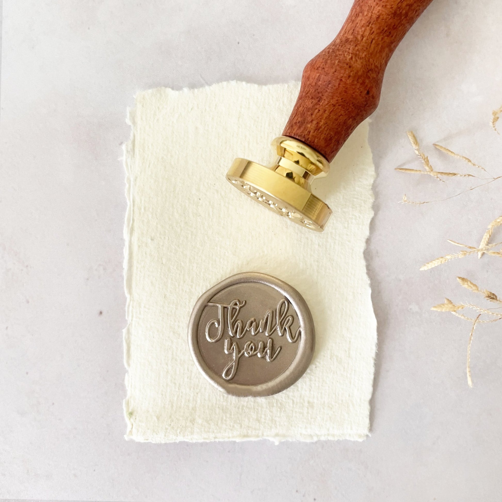 Thank You design wax seal stamp.  Make wax seals for thank you card, envelopes, gift wrapping and corporate branding.  Traditional Brass Sealing Wax Stamp with a wooden handle.  By The Natural Paper Company