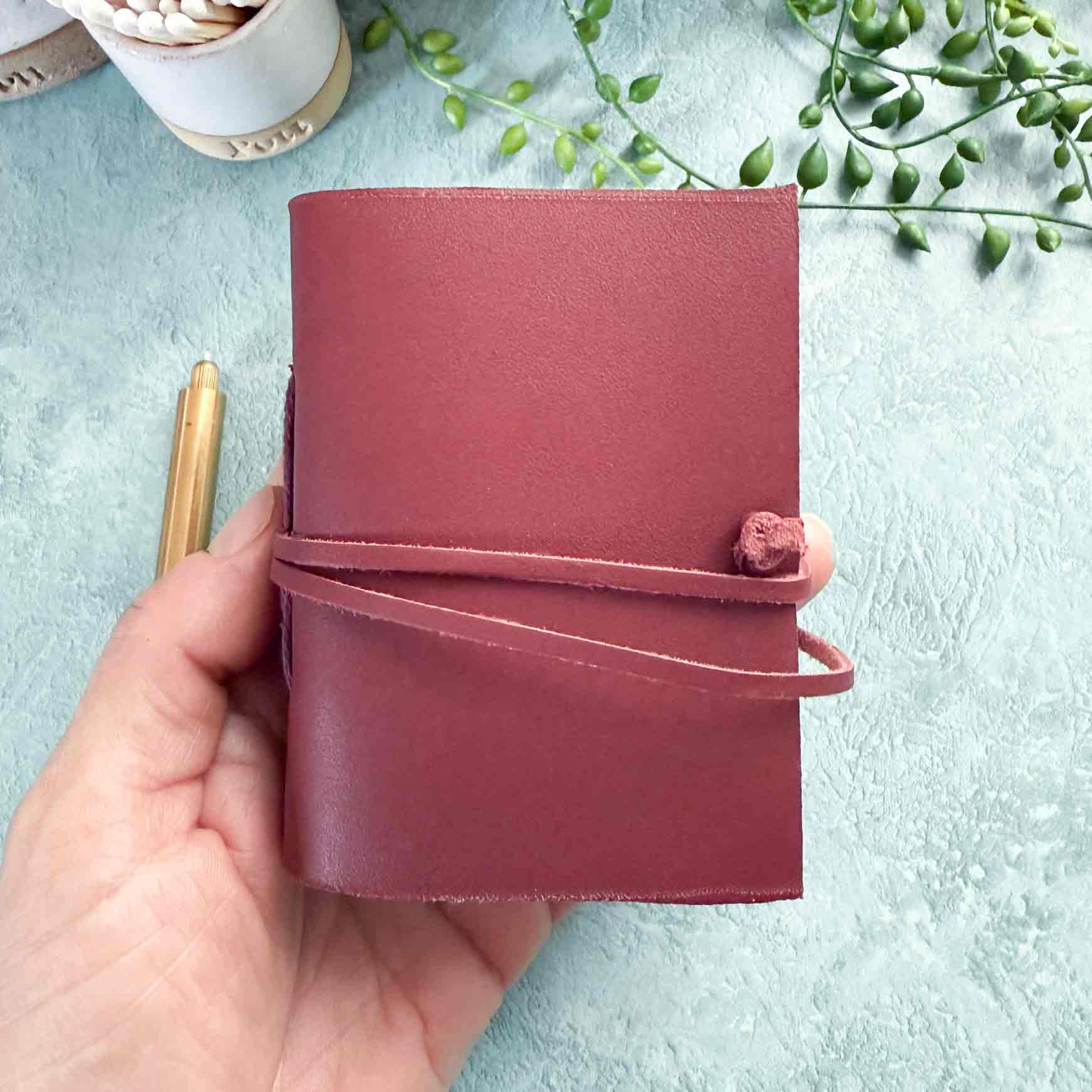 small burgundy leather blessings book or pocket journal