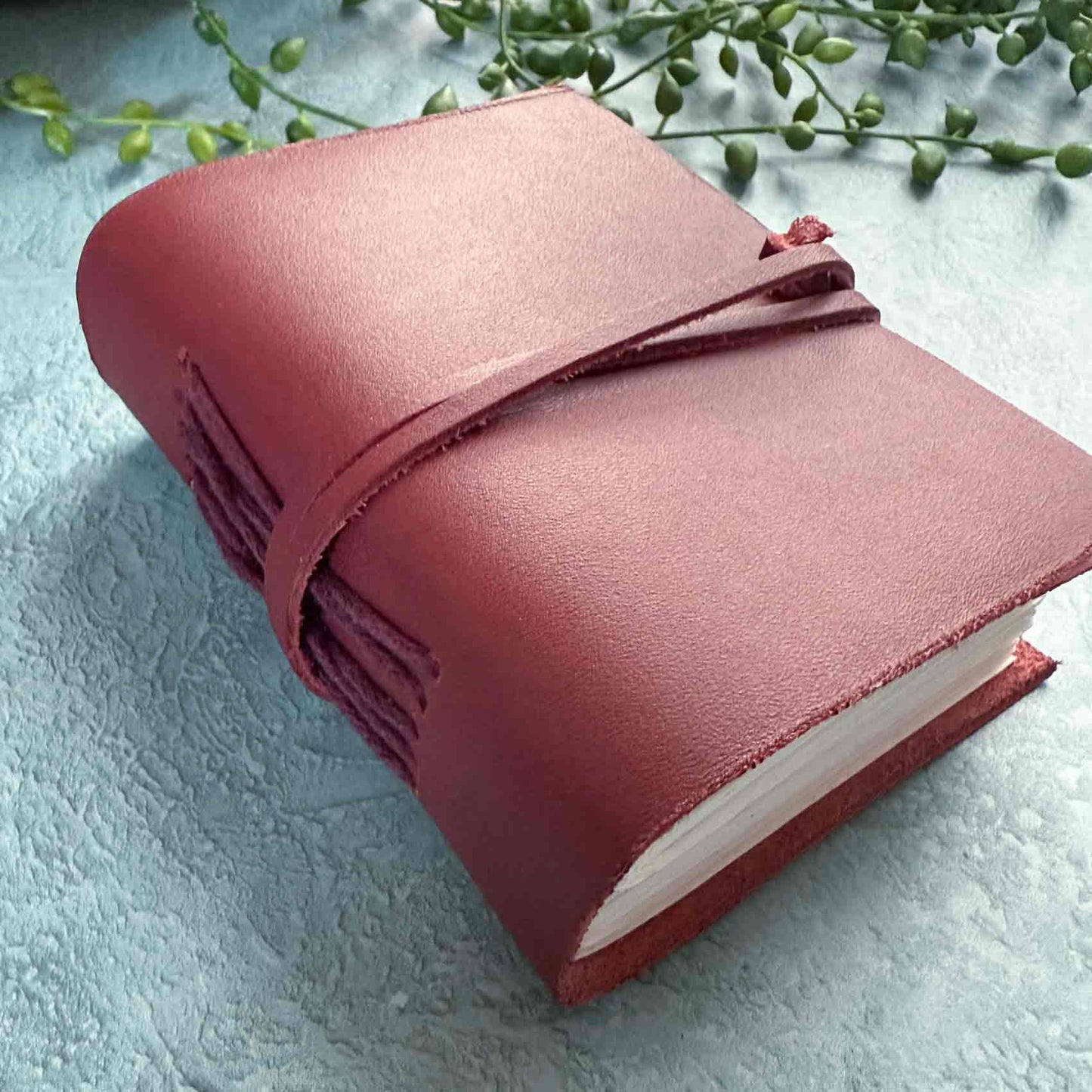 little handmade burgundy leather notebook