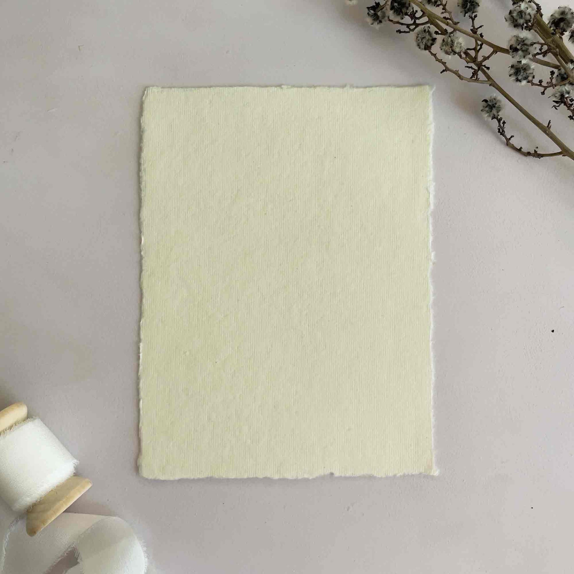 Vanilla handmade cotton rag paper with deckled edges.  Cream recycled paper by The Natural Paper Company