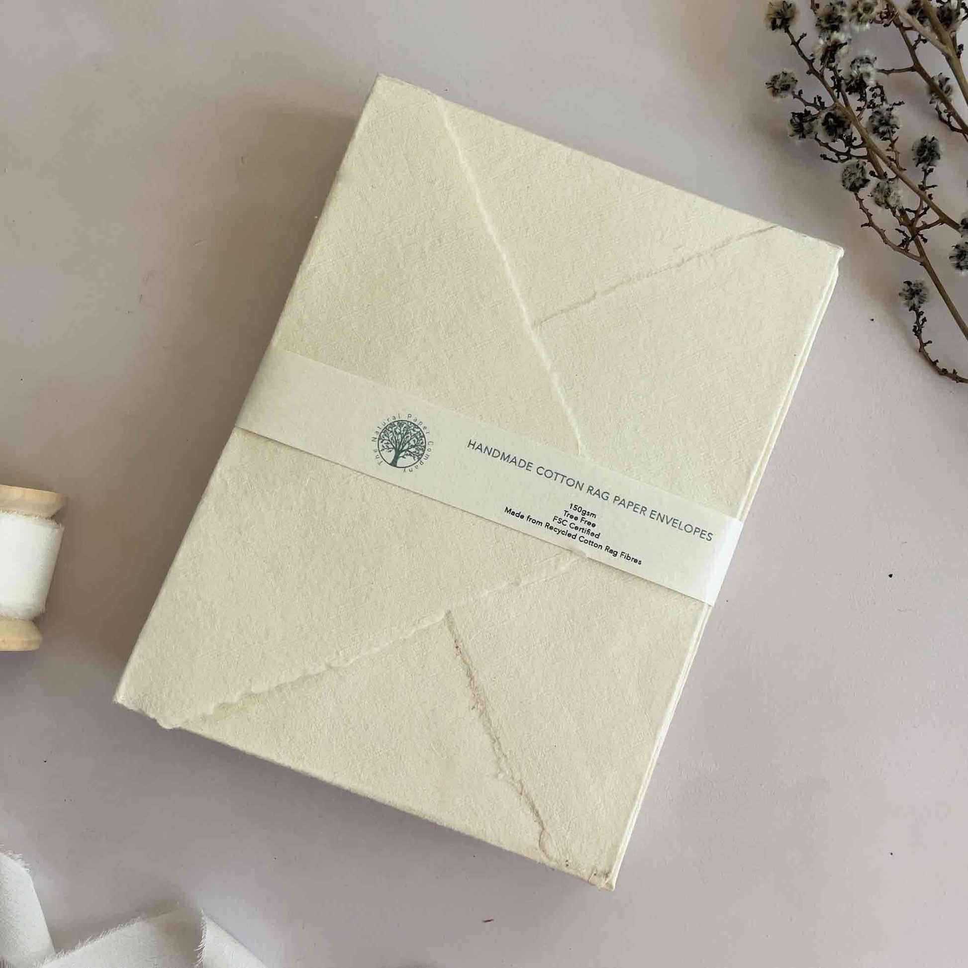 Handmade cotton rag paper envelopes with deckled edges.  Cream invitation envelopes by The Natural Paper Company