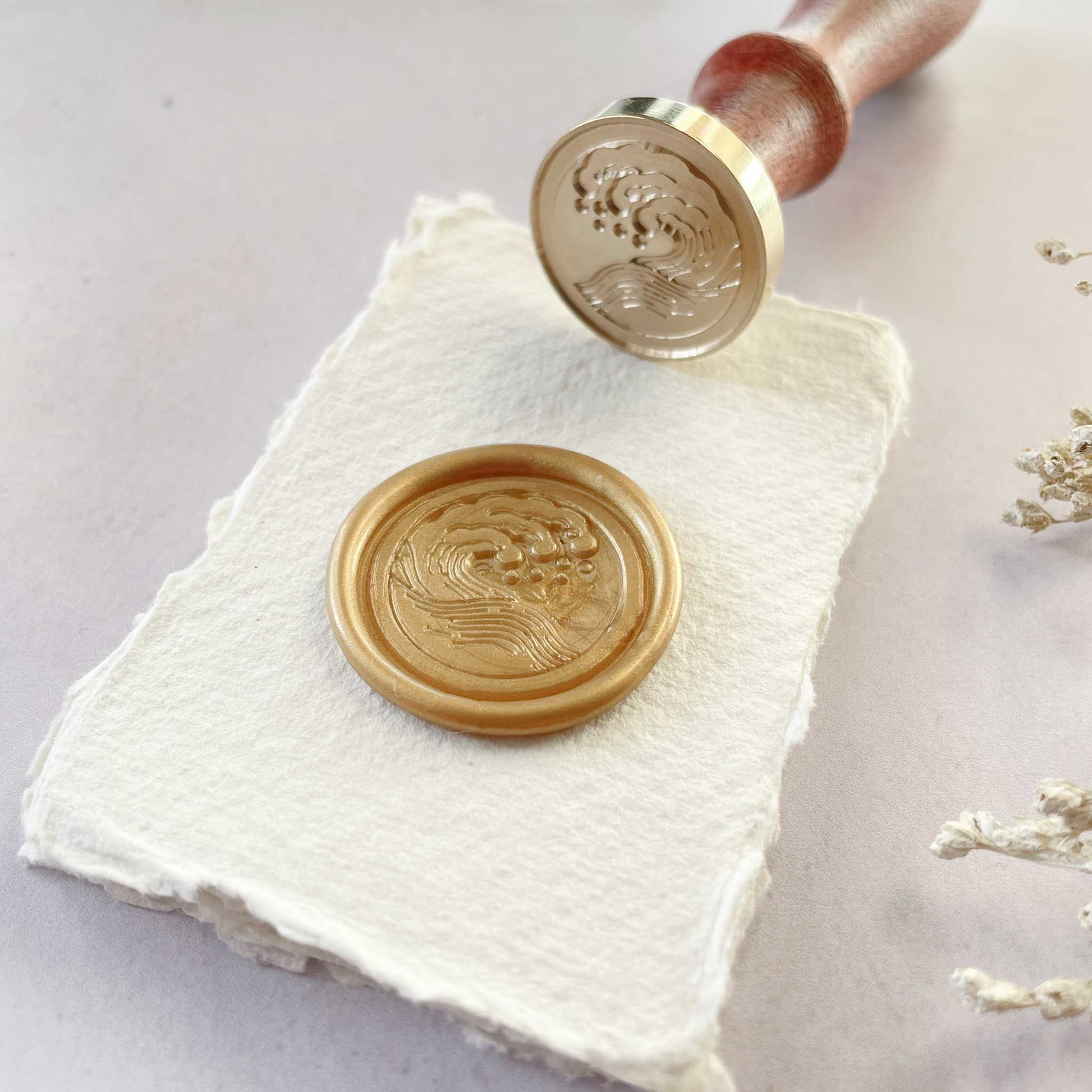 Wave design sealing wax stamps.  Make wax seals with a beach design.  Perfect for decorating envelopes, invitations and stationery.  By The Natural Paper Company