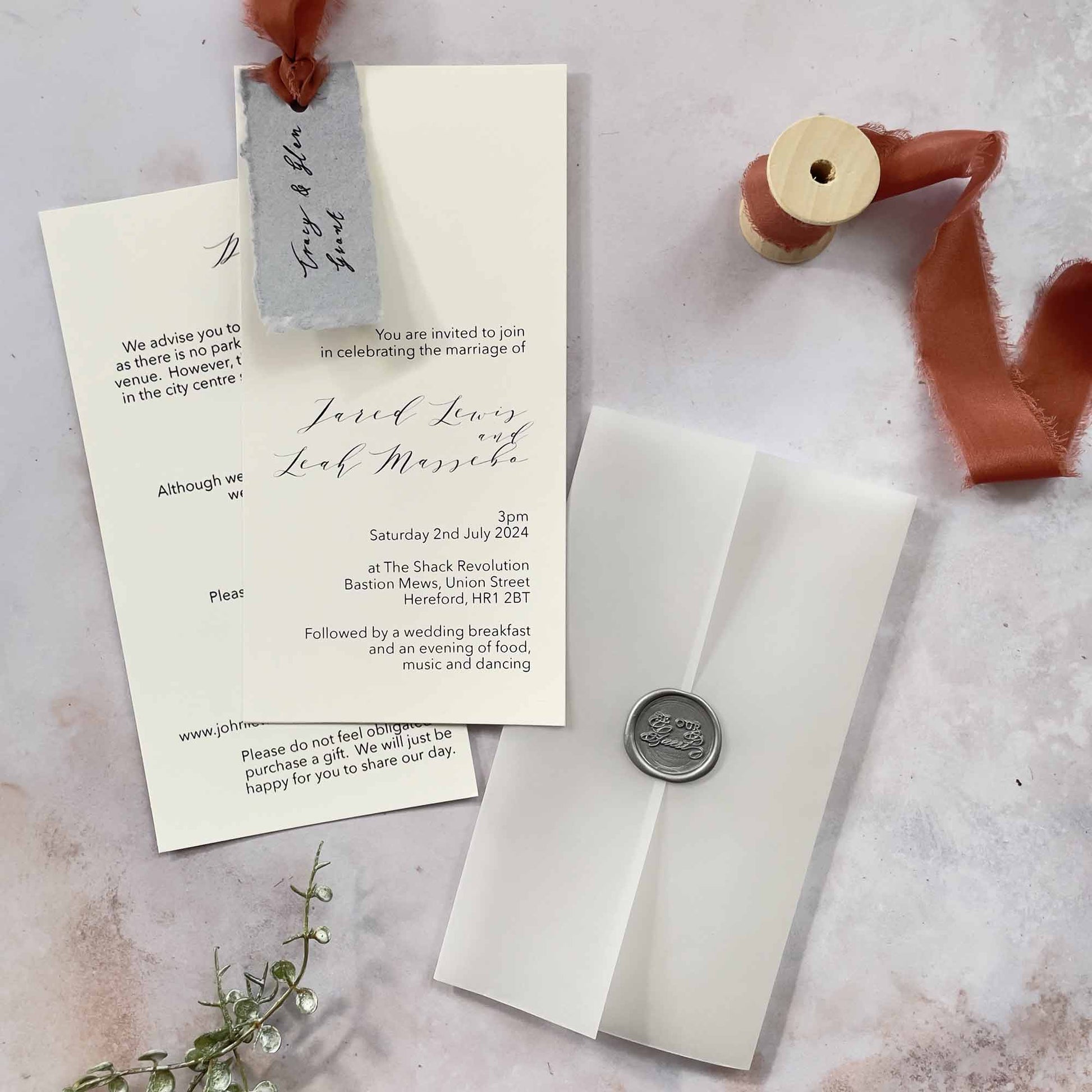 wedding invitation with vellum wrap