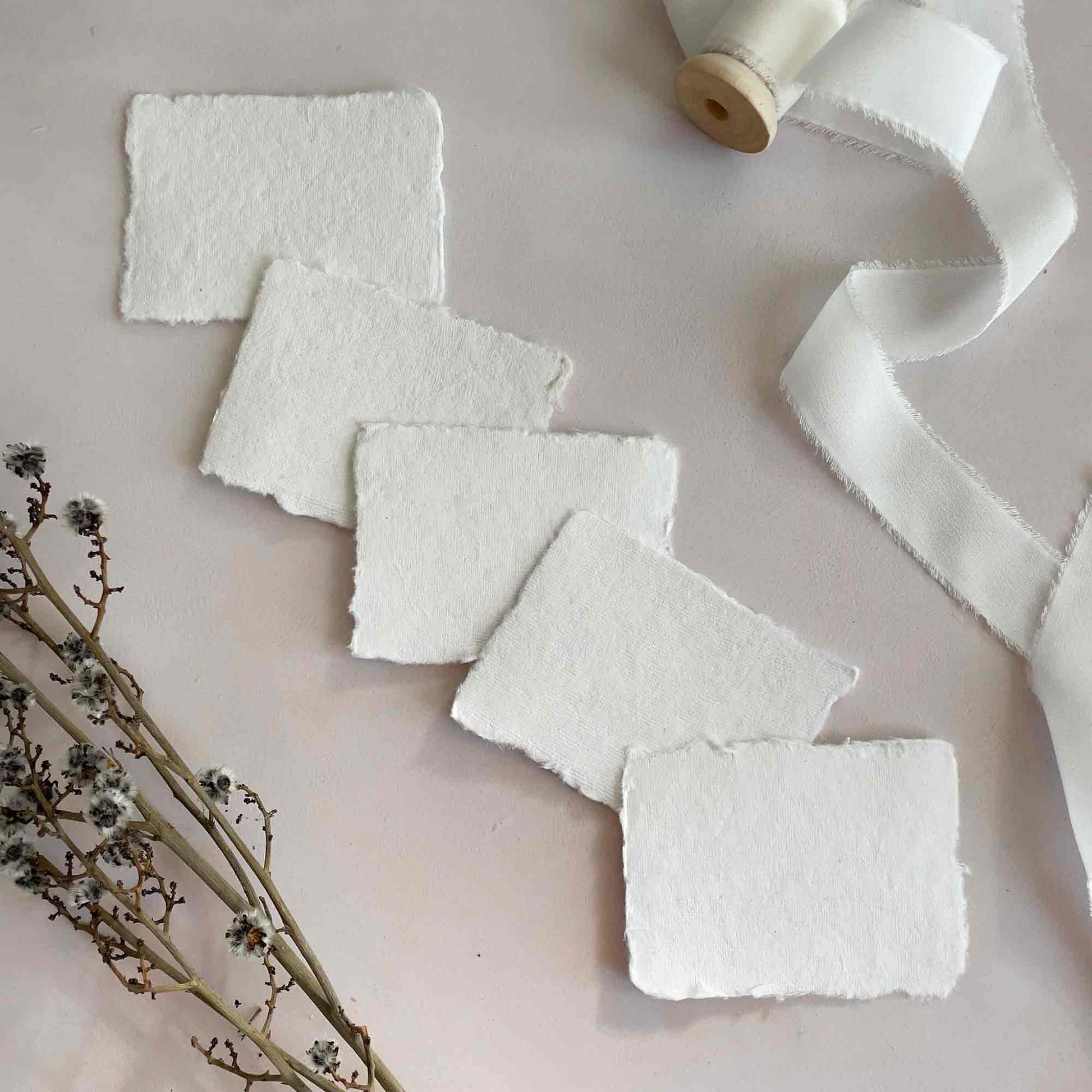 Recycled handmade paper place cards in white. Deckle edge place card panels for calligraphy.  By The Natural Paper Company