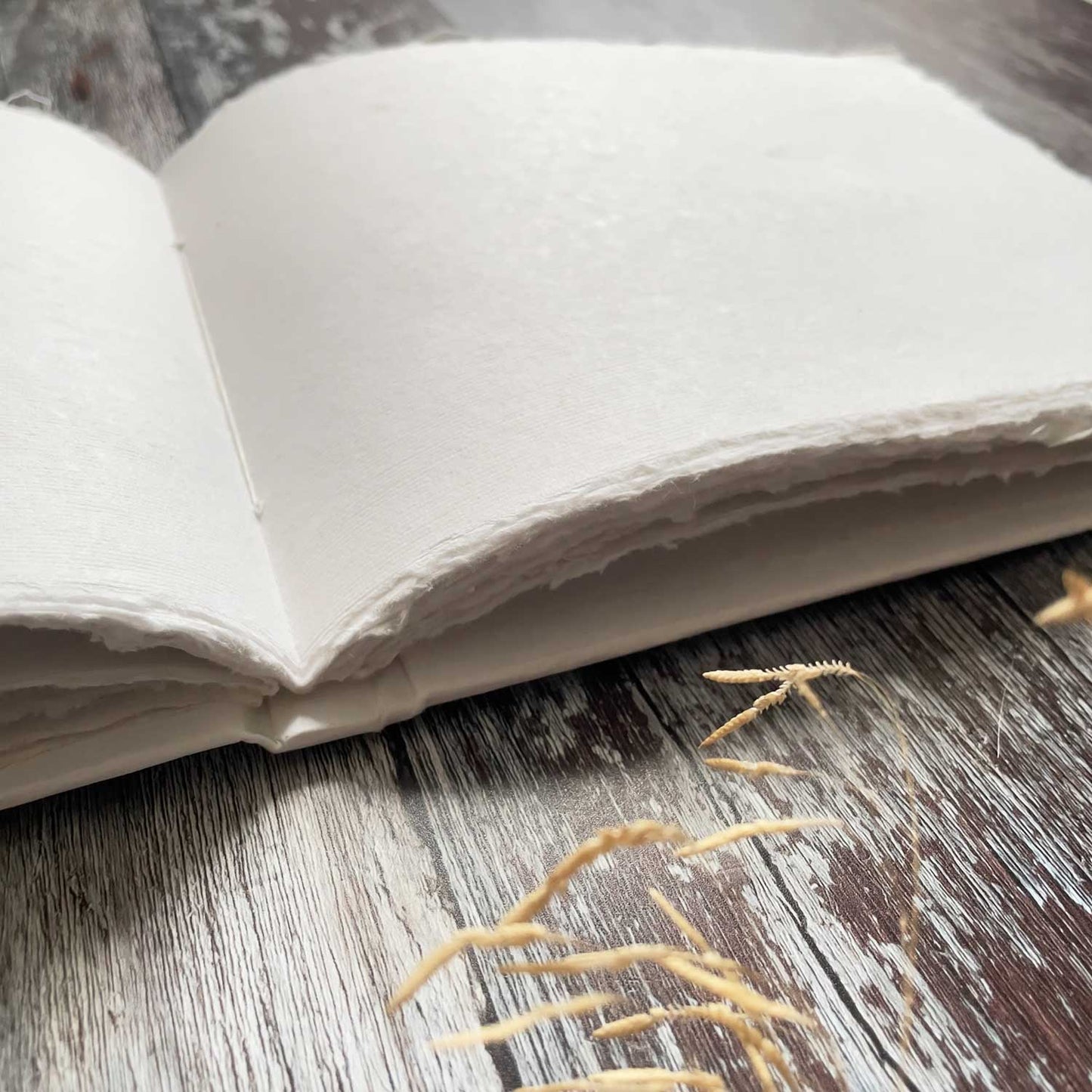 Blank white book for making guest books and journals.  50 pages.  Blank guest book with white deckle edge pages made from recycled cotton rag paper.  By The Natural Paper Company