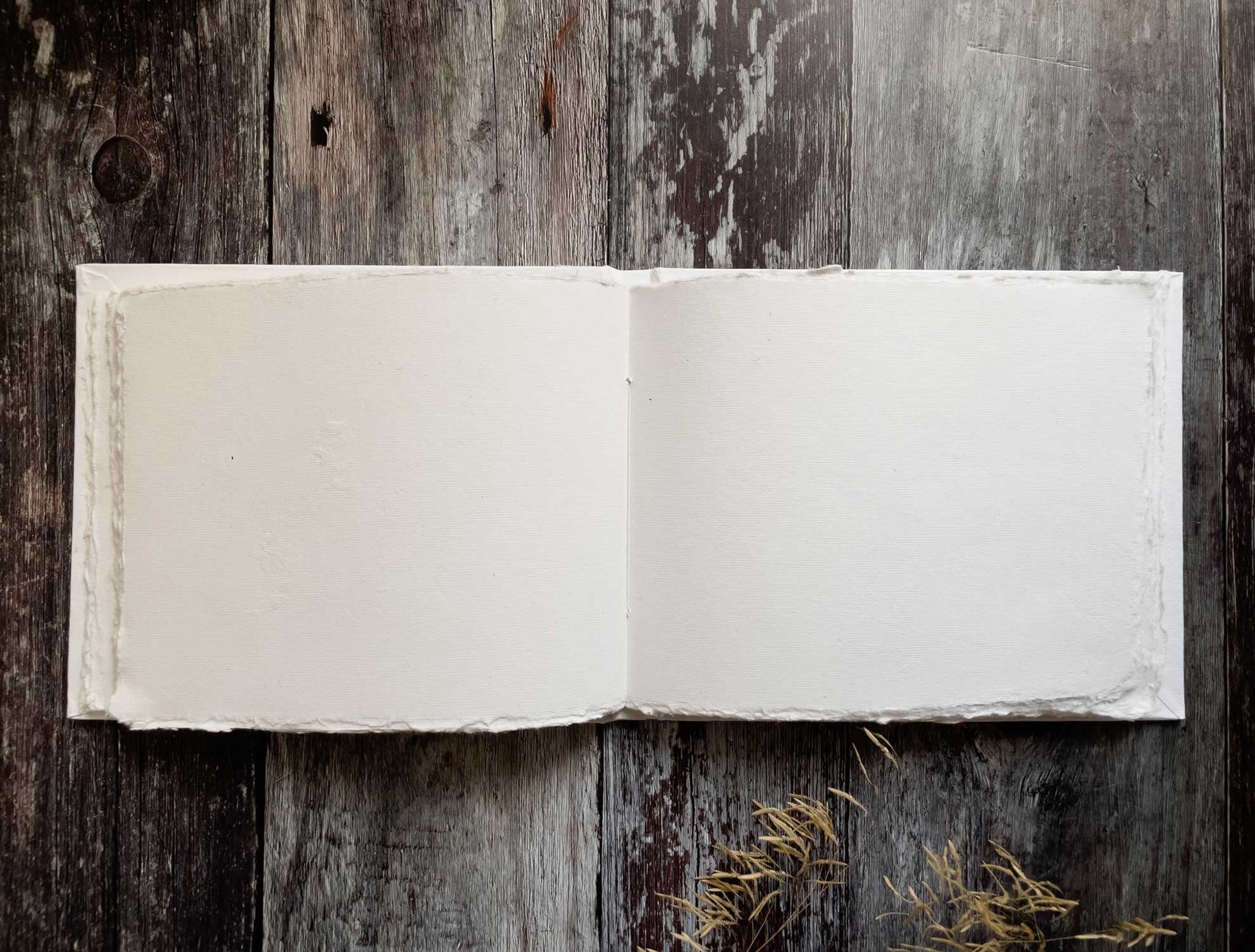 Blank book made from recycled cotton rag paper.  50 page blank guest book with a hard cover.  Handmade from white recycled paper.  Perfect for making guest books, journals, notebooks and more.   By The Natural Paper Company