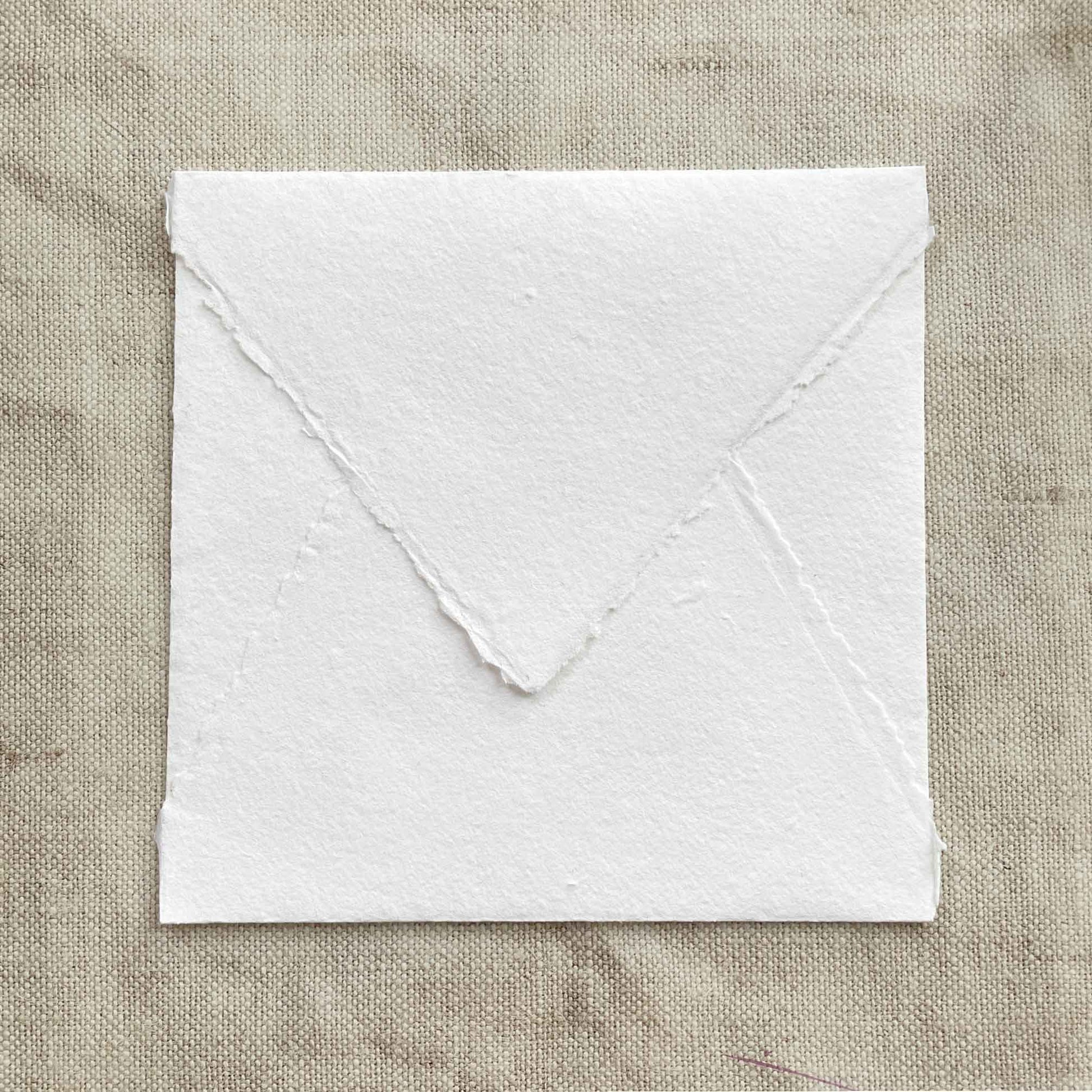 Square handmade paper envelope with deckled edges