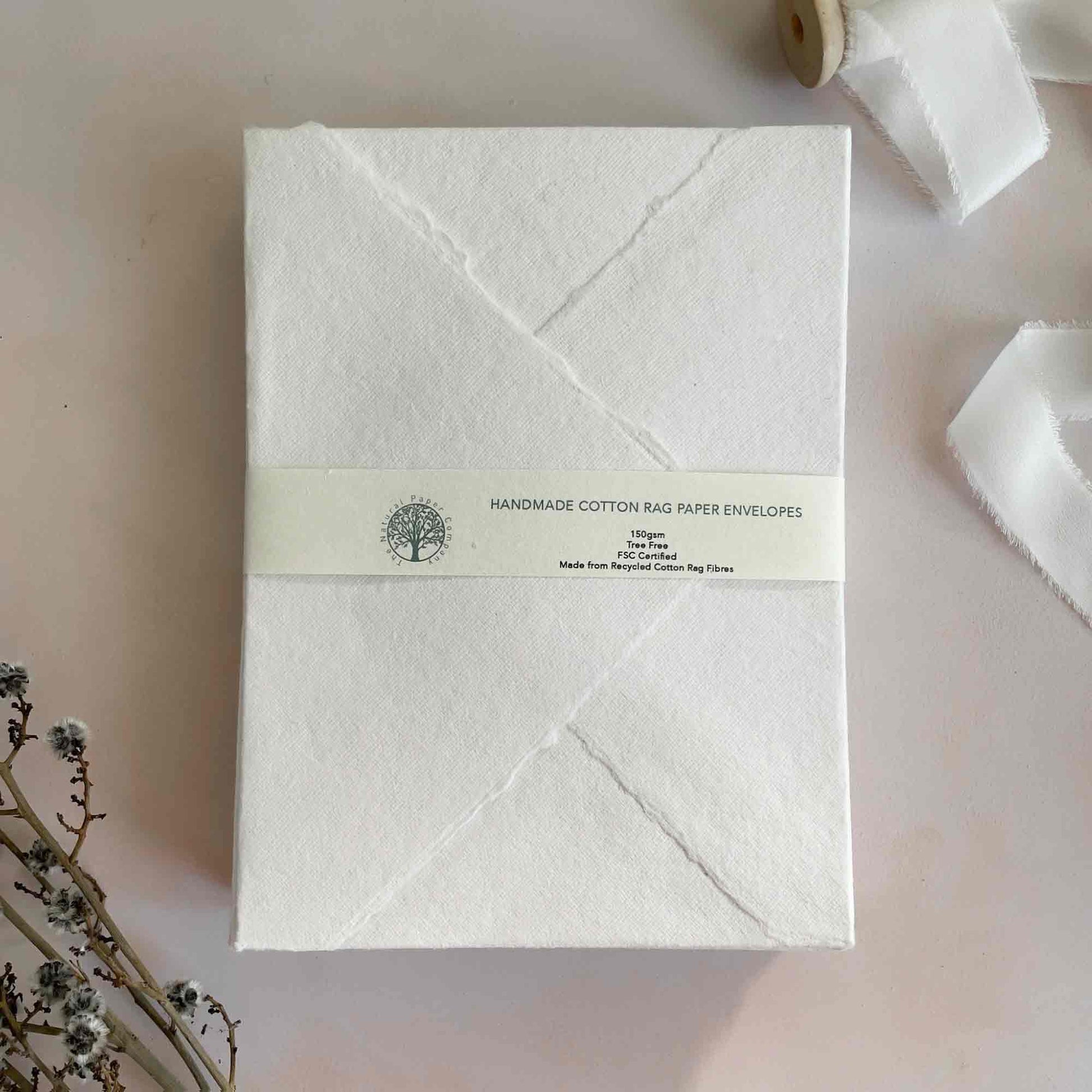 White handmade cotton rag paper envelopes with deckled edges.  Handmade invitation envelopes by The Natural Paper Company