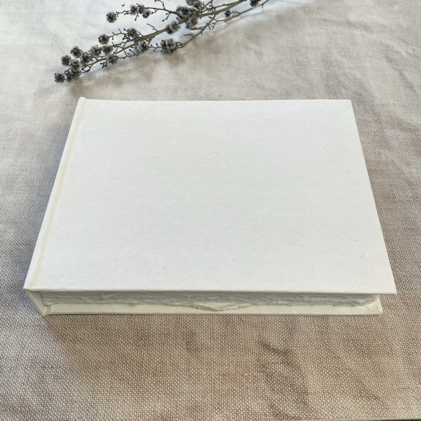 Blank notebook made from handmade recycled paper with a deckled edge,  Hard cover guest book to decorate yourself.  by The Natural Paper Company