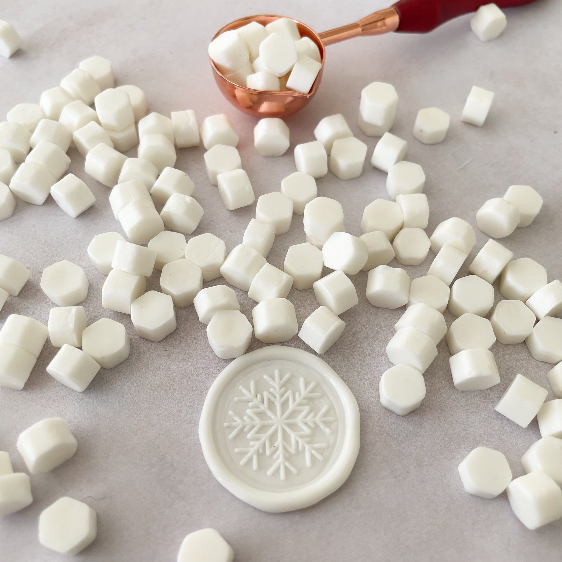 White wax seal made with eco friendly sealing wax beads by The Natural Paper Company