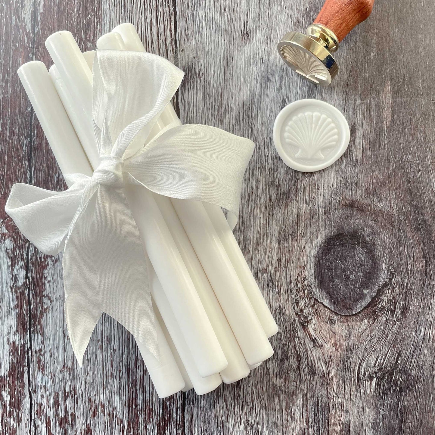 Bright white wax seal sticks by The Natural Paper Company.  Make white wax seals with our eco friendly sealing wax sticks.  Can be used with a glue gun or a melting spoon.  Plastic free, paraffin free and biodegradable.