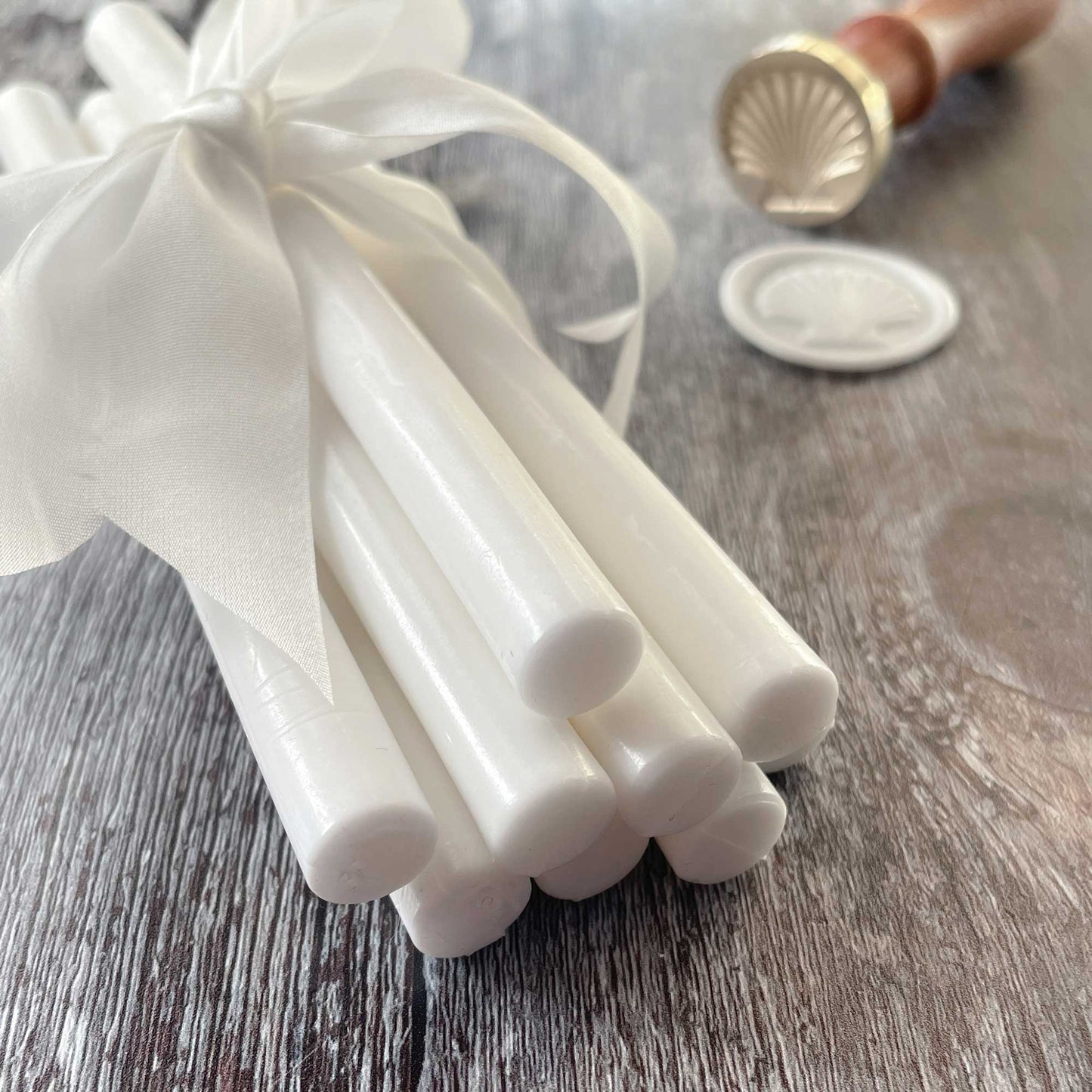 Sealing wax sticks in white.  Eco friendly wax for making wax seals.  These high quality wax sticks can be used in a glue gun or with a melting spoon.  by The Natural Paper Company