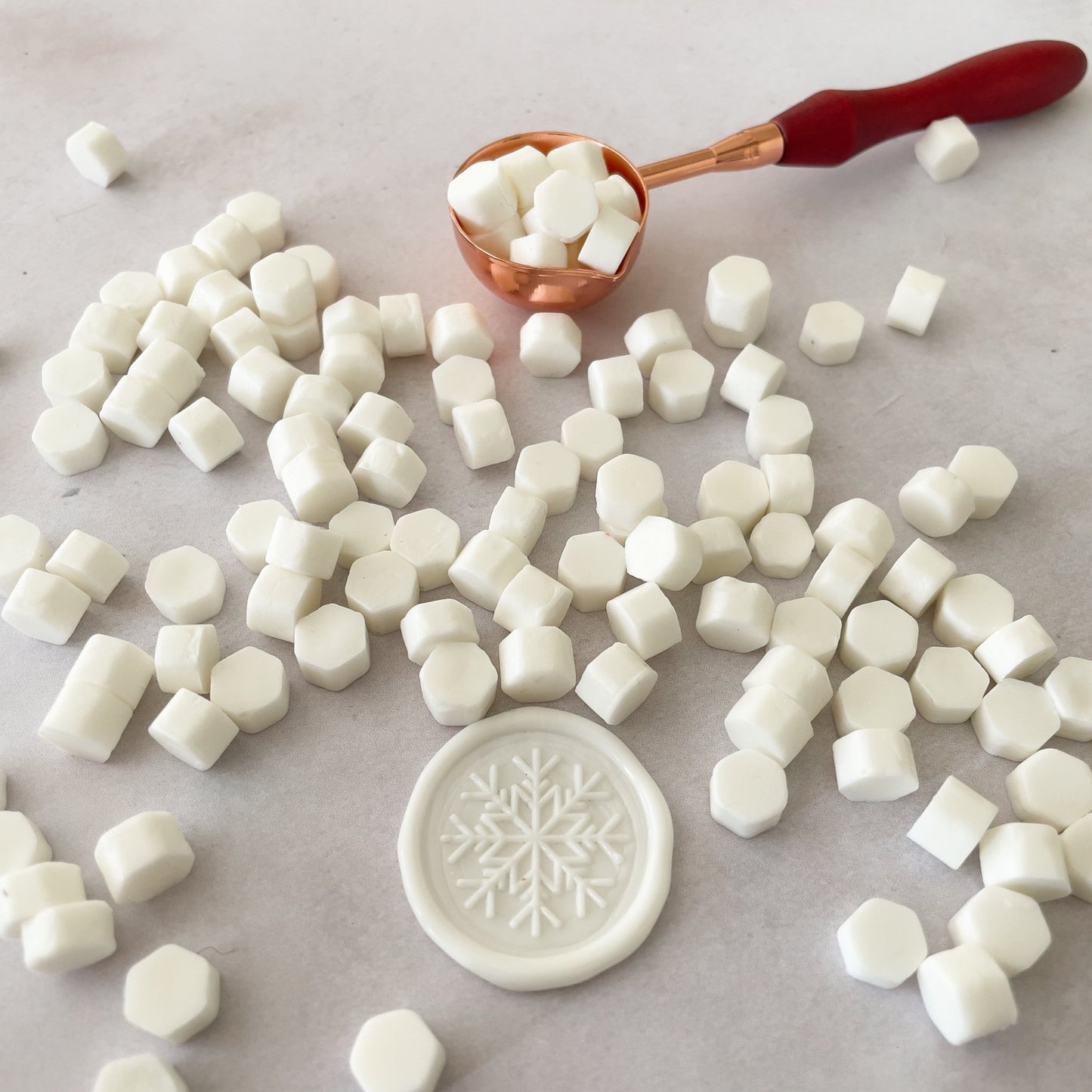 White sealing wax beads.  Eco friendly wax to make wax seals with a sealing wax stamp and melting spoon.