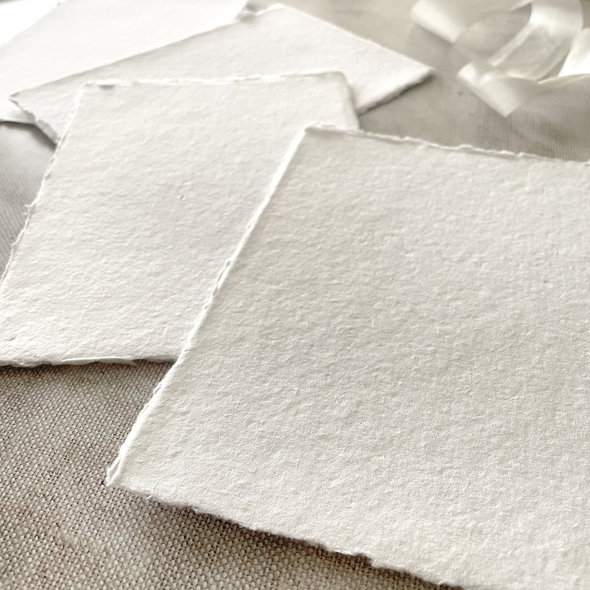 White handmade recycled card with a deckled edge.  Superior quality handmade cotton rag paper in white.  By The Natural Paper Company